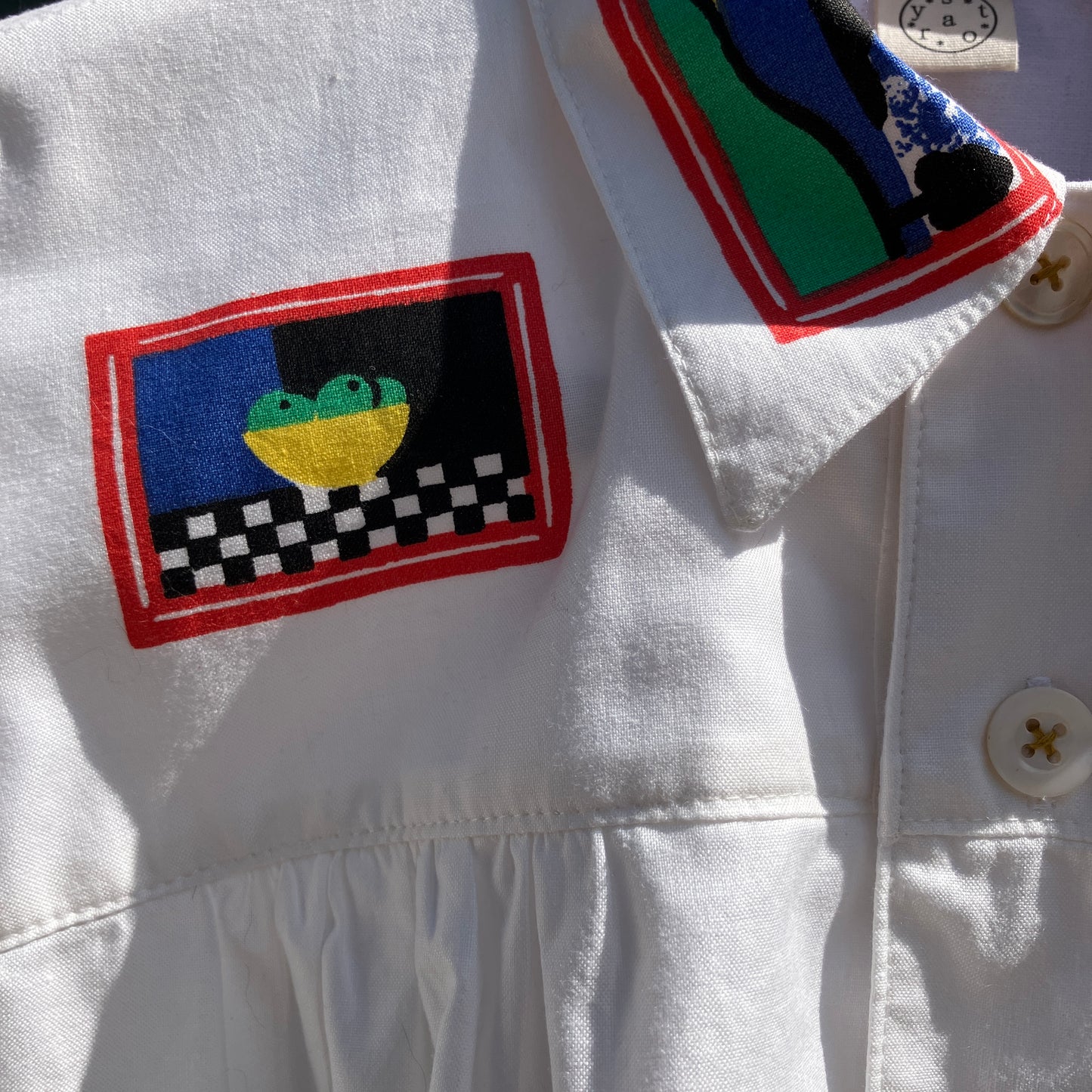 shirt made from 80s deadstock fabric with a print of tiny paintings in frames