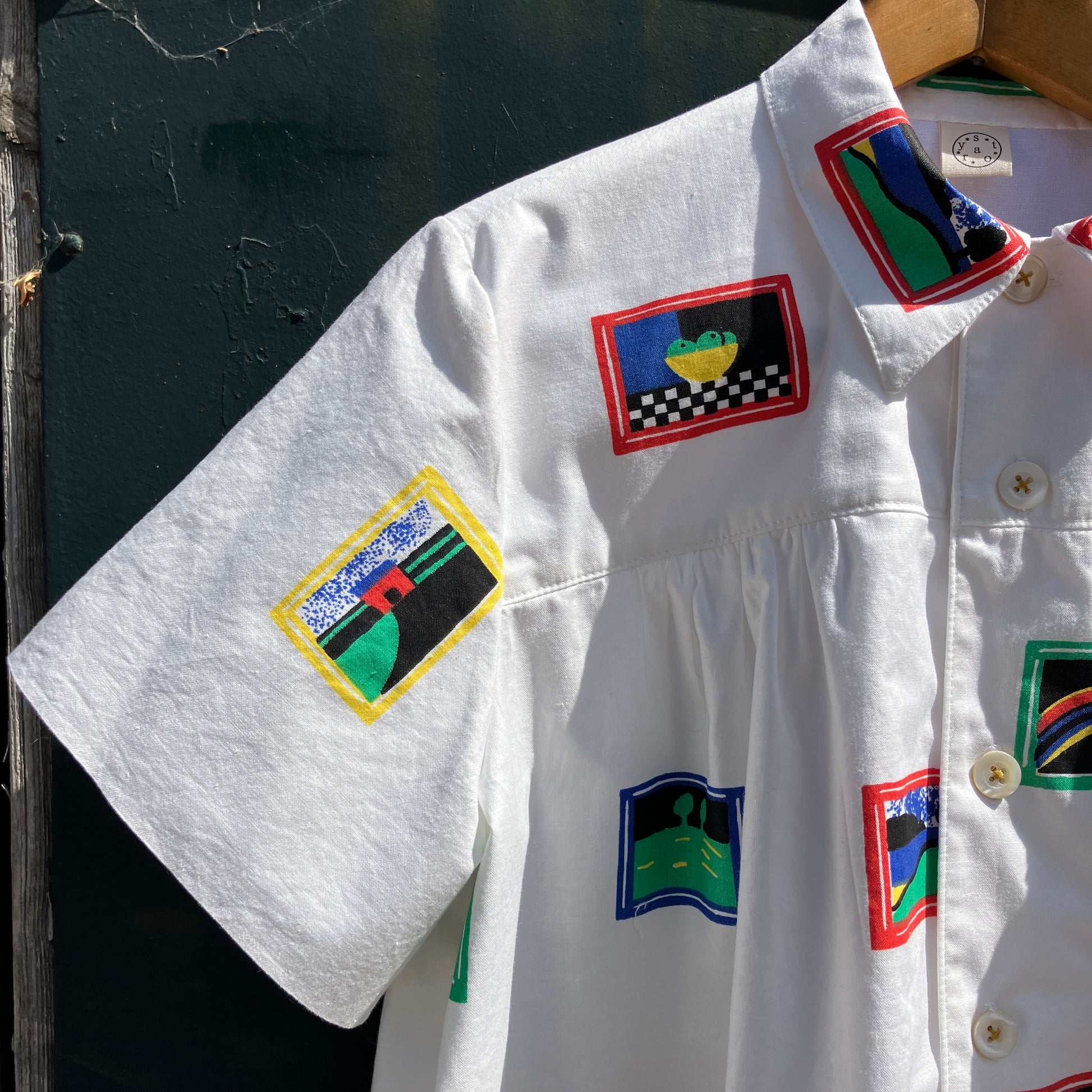 shirt made from 80s deadstock fabric with a print of tiny paintings in frames