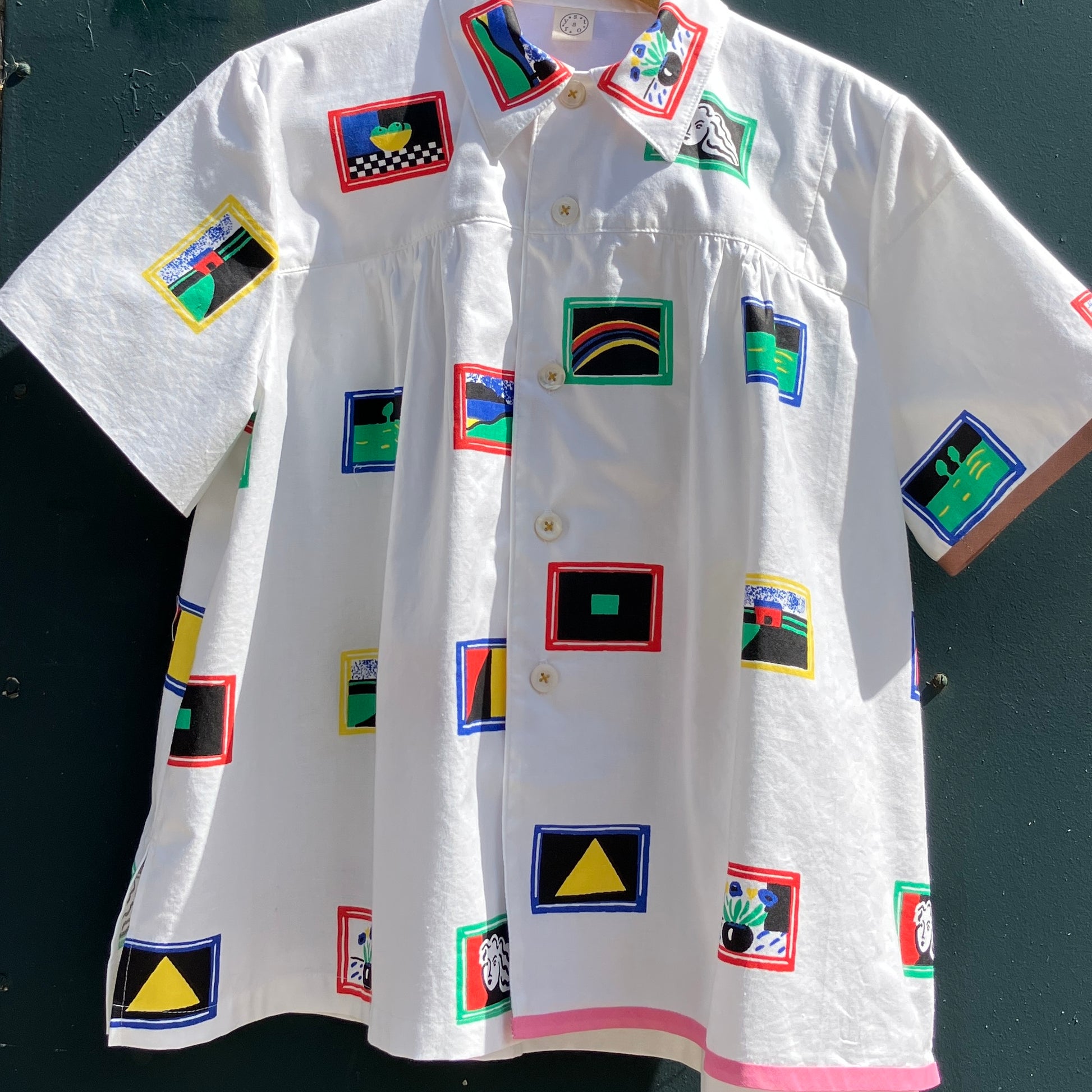 shirt made from 80s deadstock fabric with a print of tiny paintings in frames