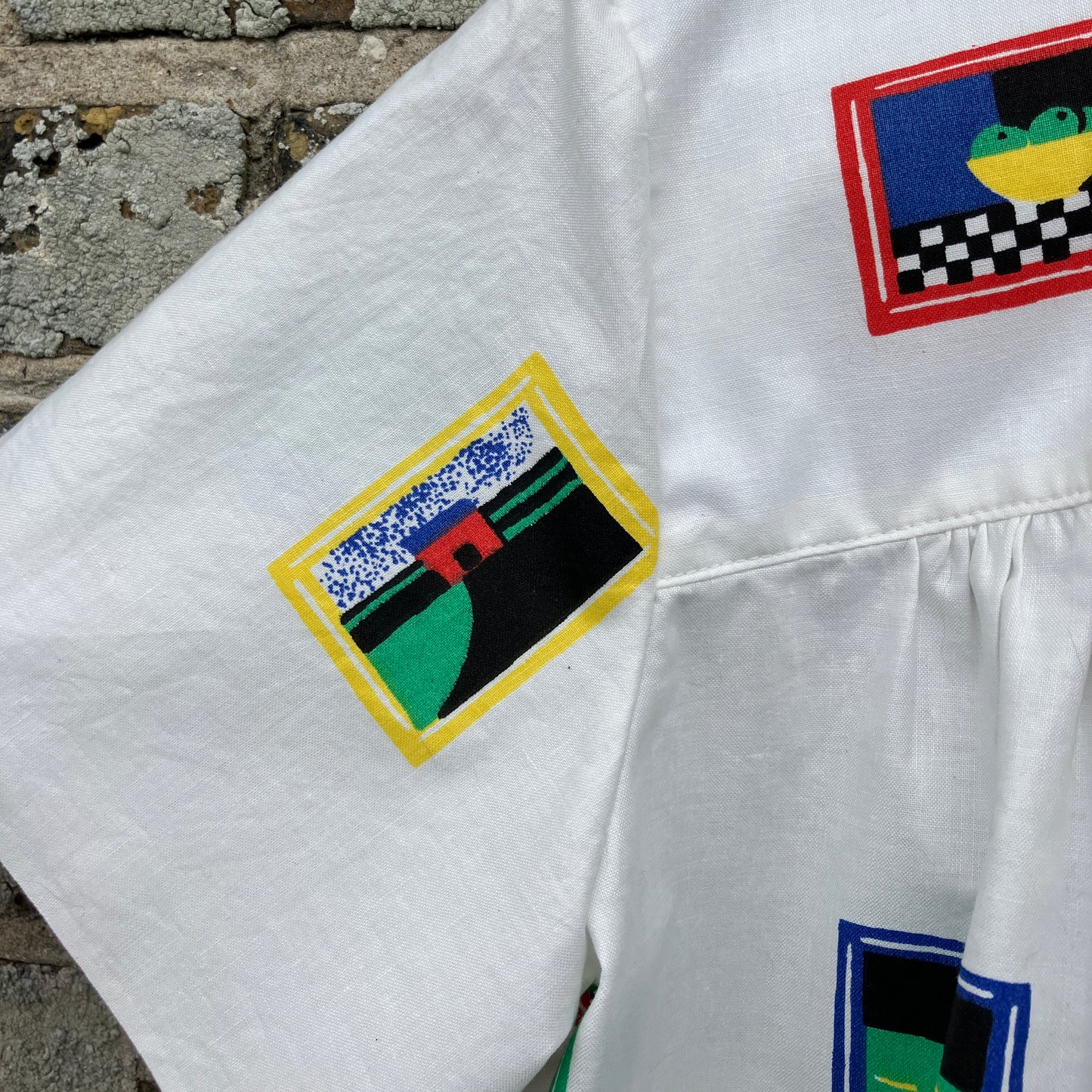 shirt made from 80s deadstock fabric with a print of tiny paintings in frames