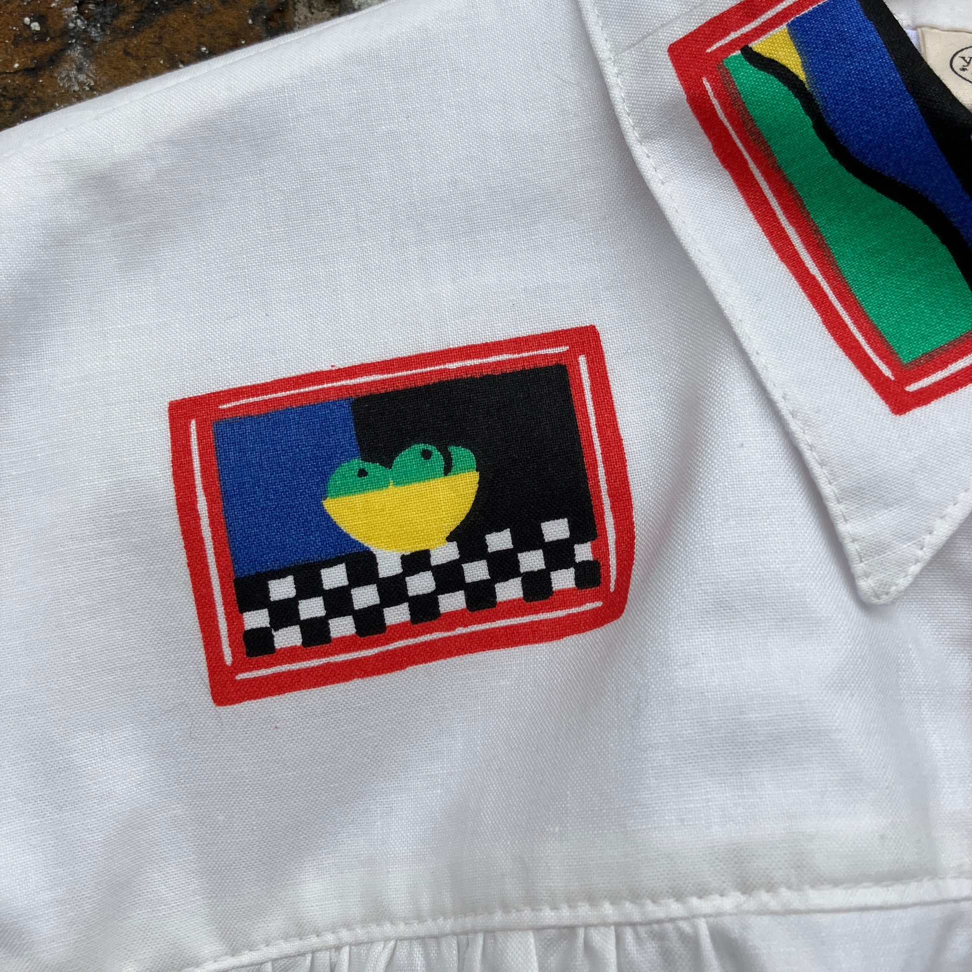 shirt made from 80s deadstock fabric with a print of tiny paintings in frames