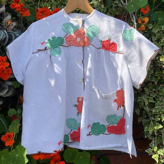 summer top hand made from a reclaimed tablecloth with appliqué nasturtiums in red, orange, peach and green