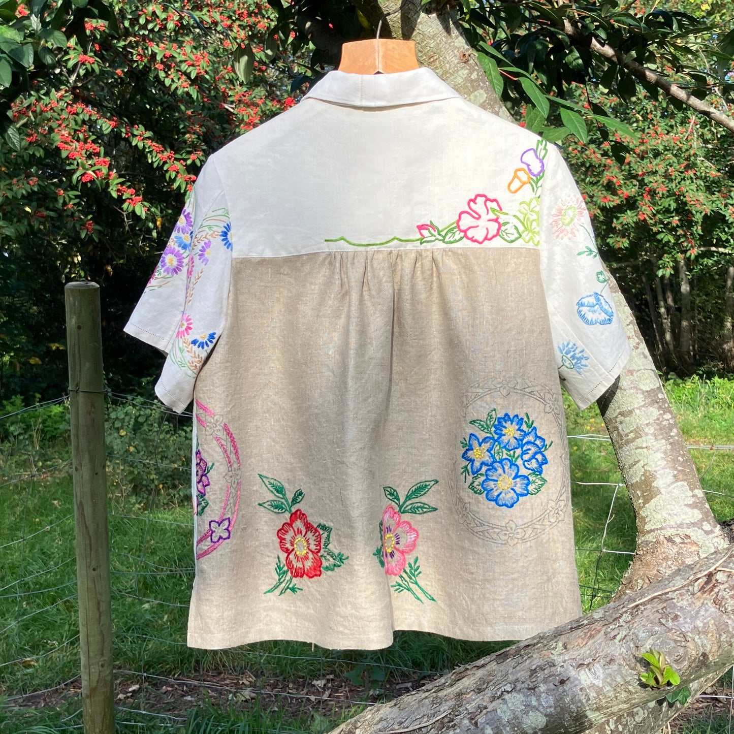 Shirt made from a patchwork of part-finished hand embroidered linen panels in various shades of off-white and natural.