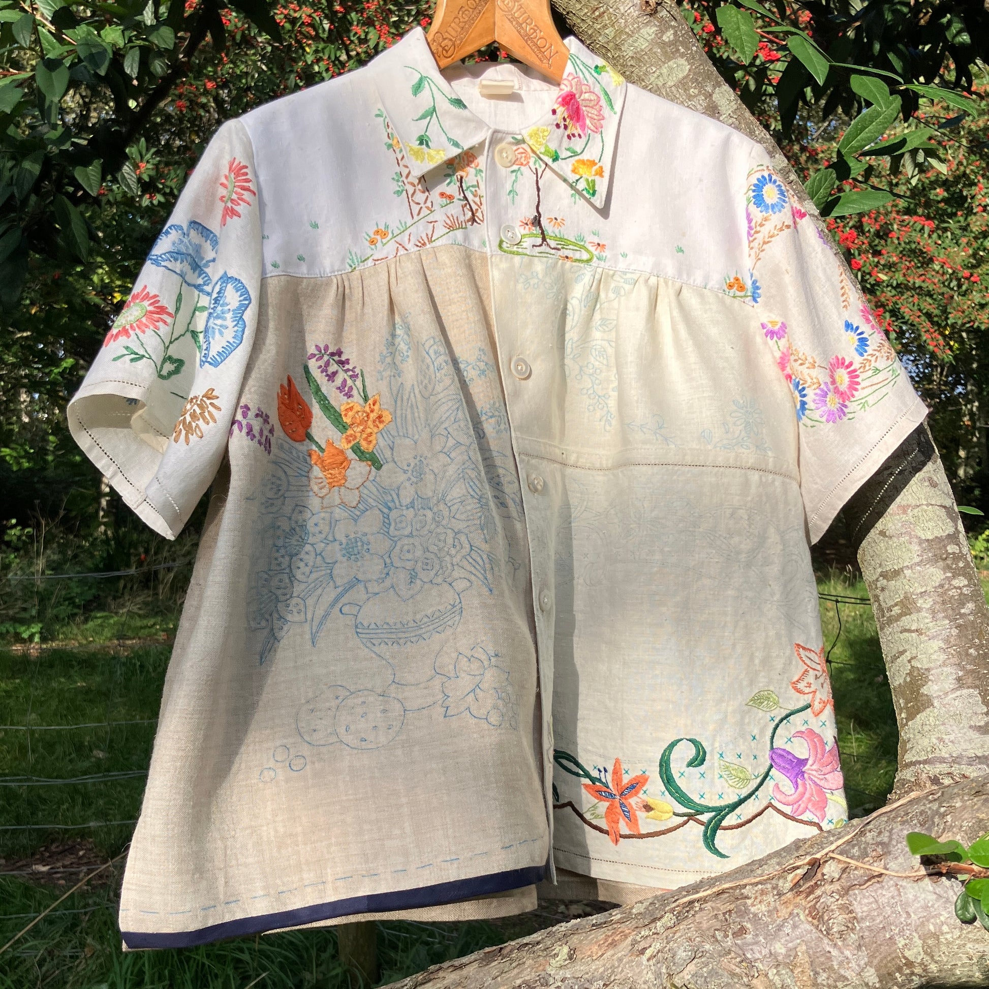 Shirt made from a patchwork of part-finished hand embroidered linen panels in various shades of off-white and natural.