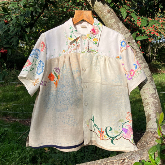 Shirt made from a patchwork of part-finished hand embroidered linen panels in various shades of off-white and natural.