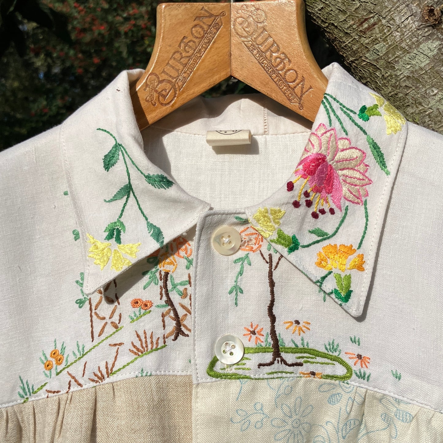Shirt made from a patchwork of part-finished hand embroidered linen panels in various shades of off-white and natural.