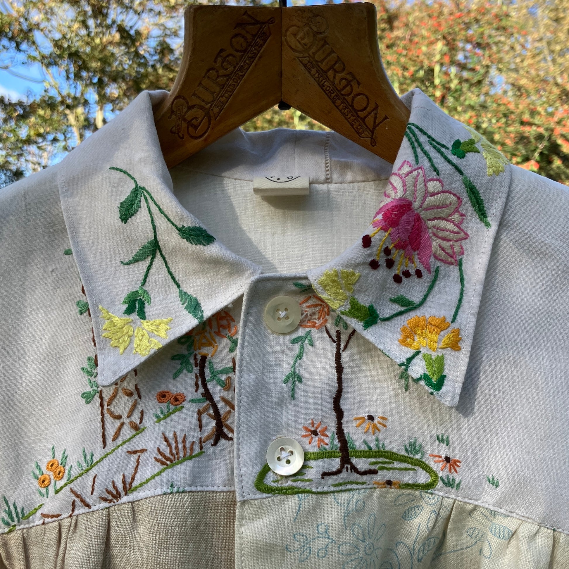 Shirt made from a patchwork of part-finished hand embroidered linen panels in various shades of off-white and natural.