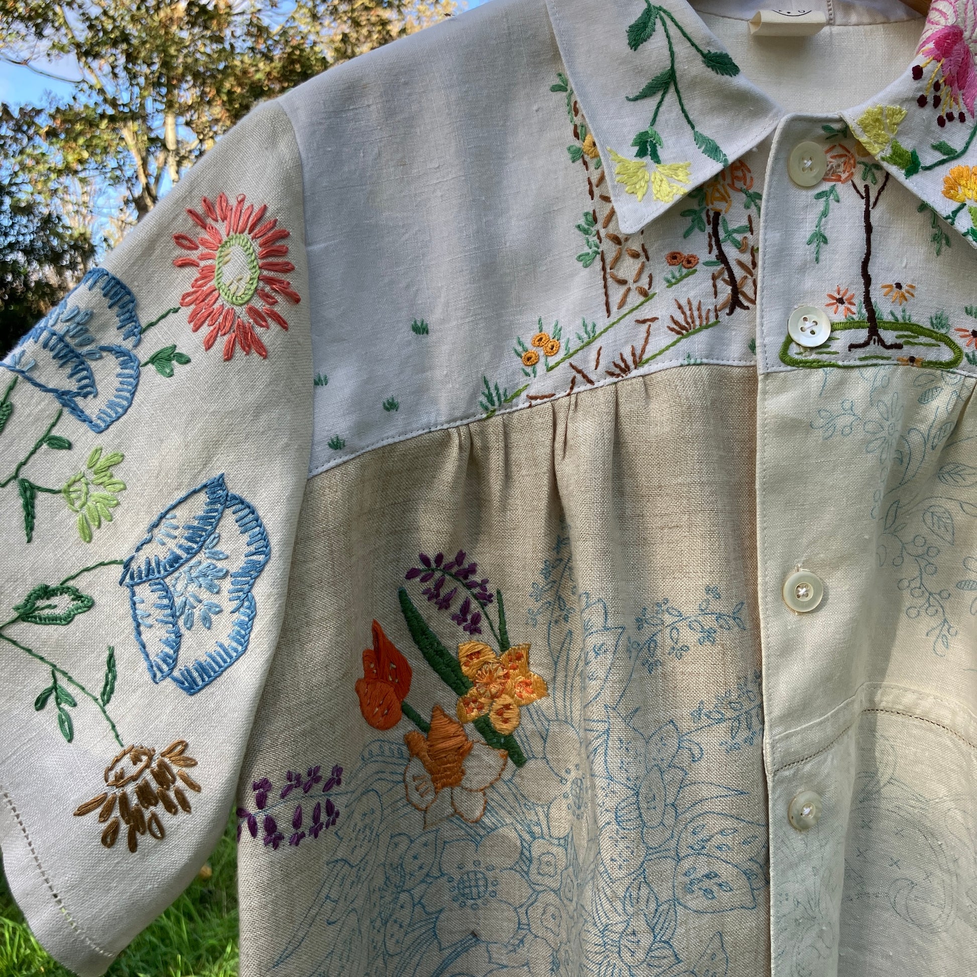 Shirt made from a patchwork of part-finished hand embroidered linen panels in various shades of off-white and natural.
