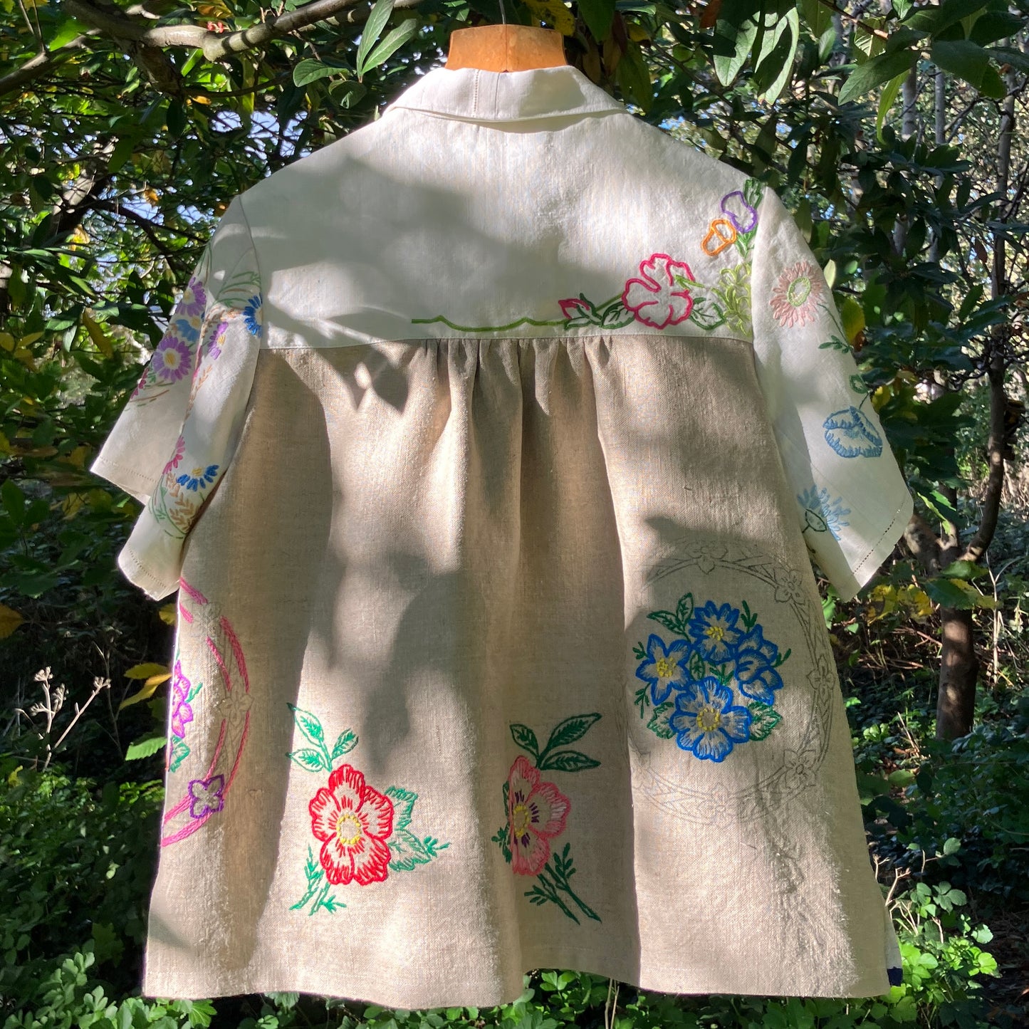Shirt made from a patchwork of part-finished hand embroidered linen panels in various shades of off-white and natural.