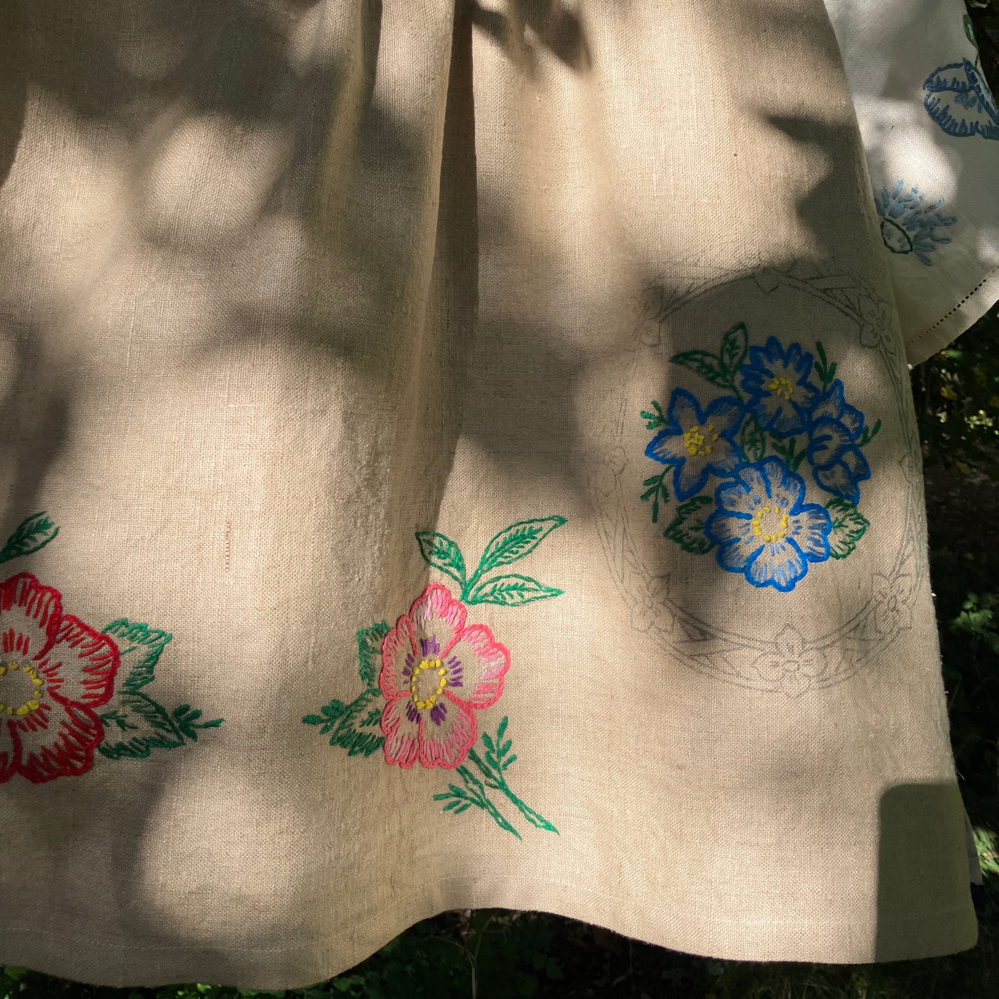 Shirt made from a patchwork of part-finished hand embroidered linen panels in various shades of off-white and natural.