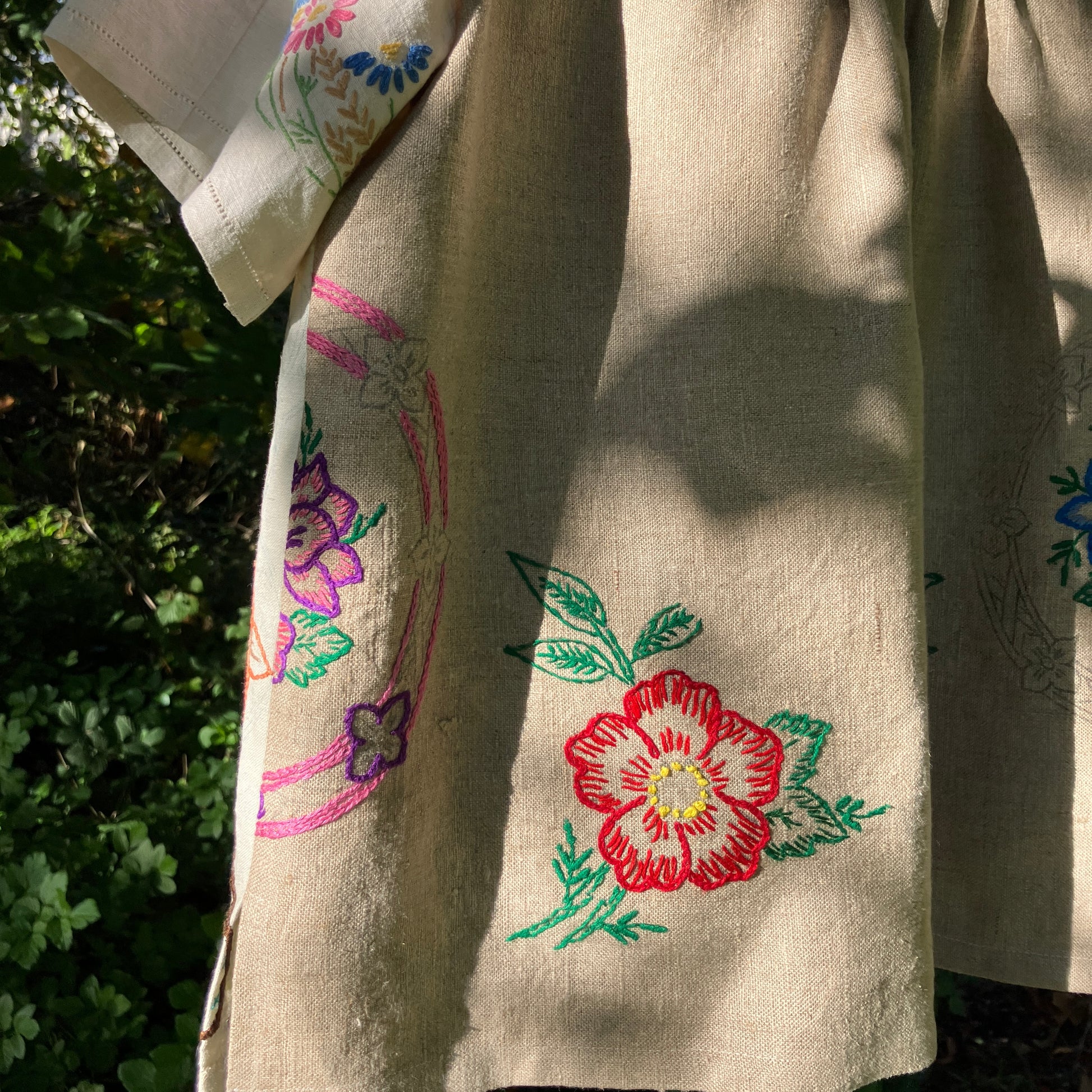 Shirt made from a patchwork of part-finished hand embroidered linen panels in various shades of off-white and natural.