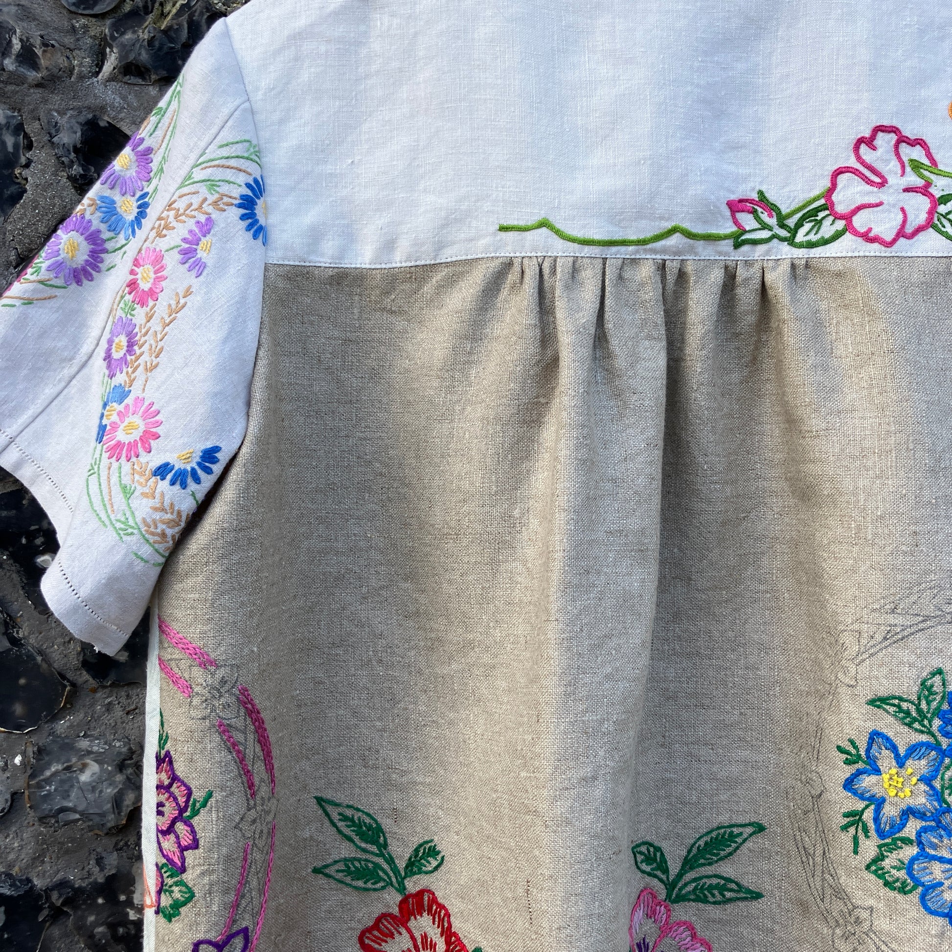 Shirt made from a patchwork of part-finished hand embroidered linen panels in various shades of off-white and natural.