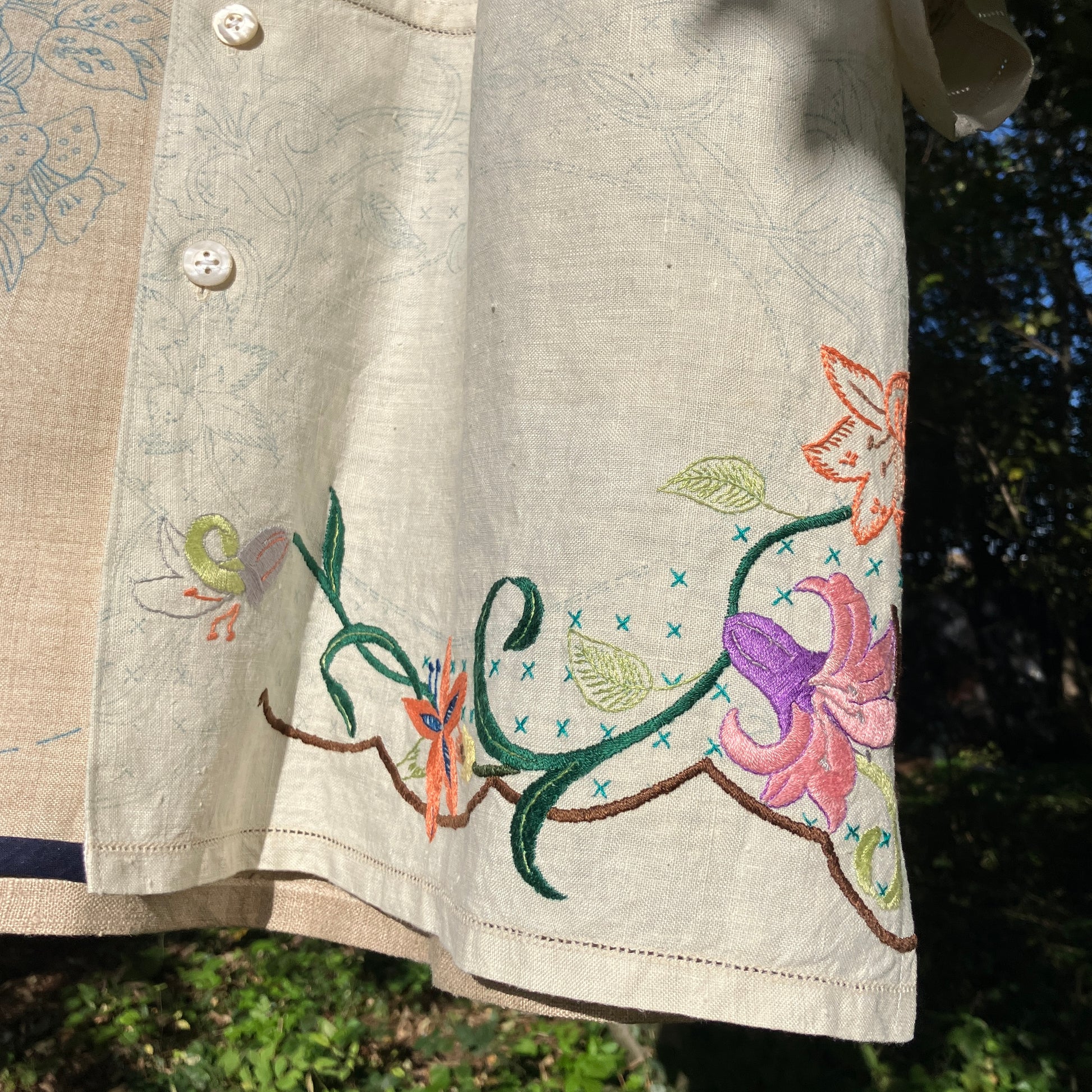 Shirt made from a patchwork of part-finished hand embroidered linen panels in various shades of off-white and natural.