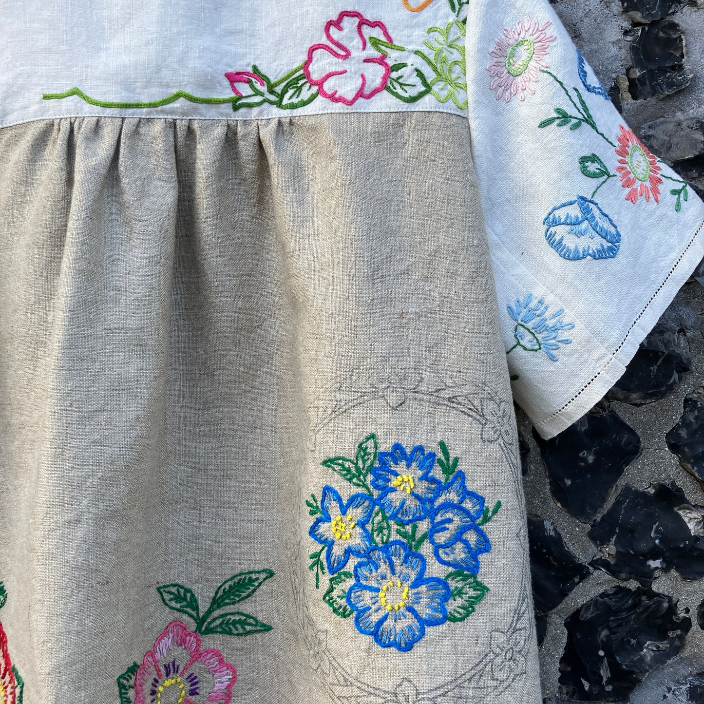 Shirt made from a patchwork of part-finished hand embroidered linen panels in various shades of off-white and natural.