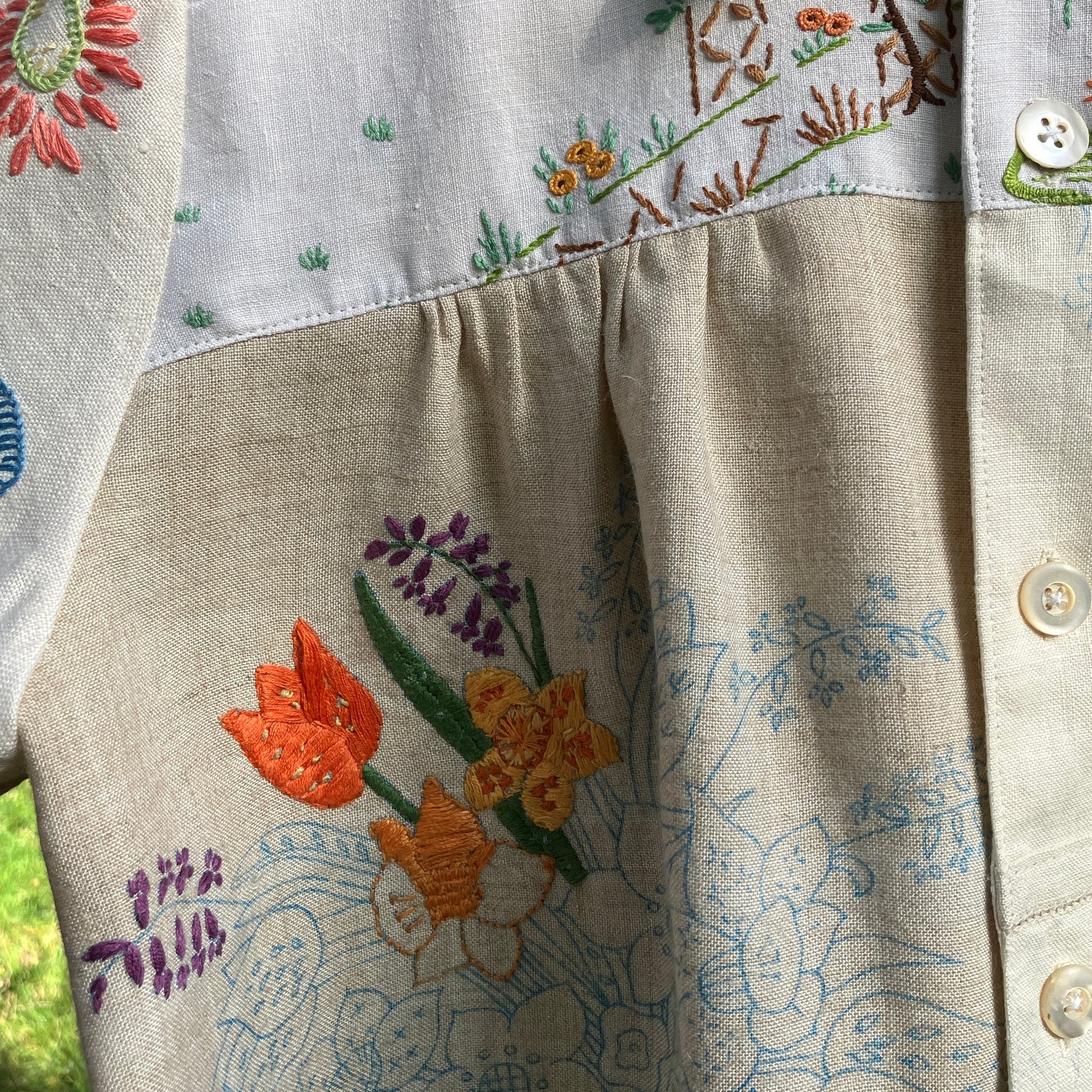 Shirt made from a patchwork of part-finished hand embroidered linen panels in various shades of off-white and natural.