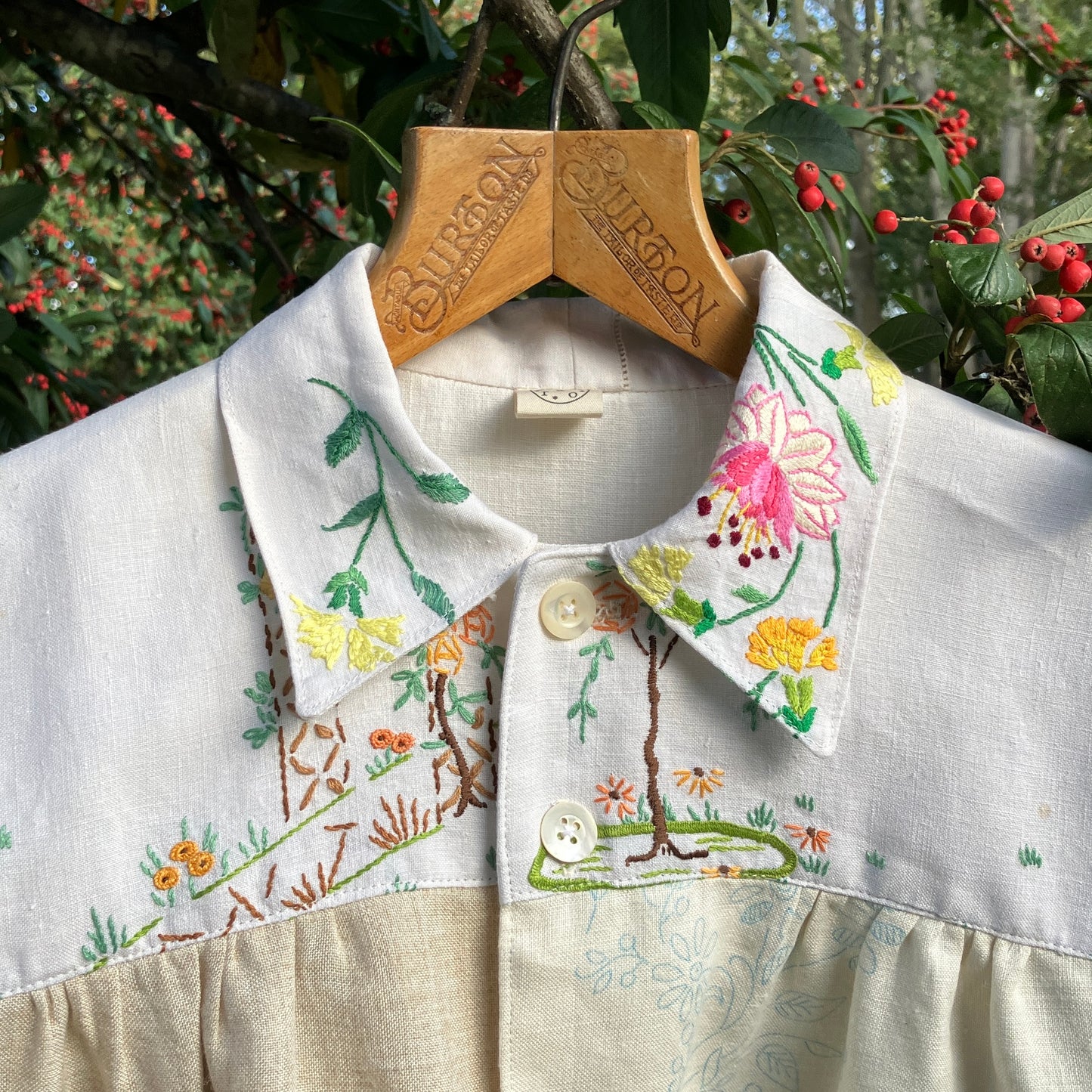 Shirt made from a patchwork of part-finished hand embroidered linen panels in various shades of off-white and natural.