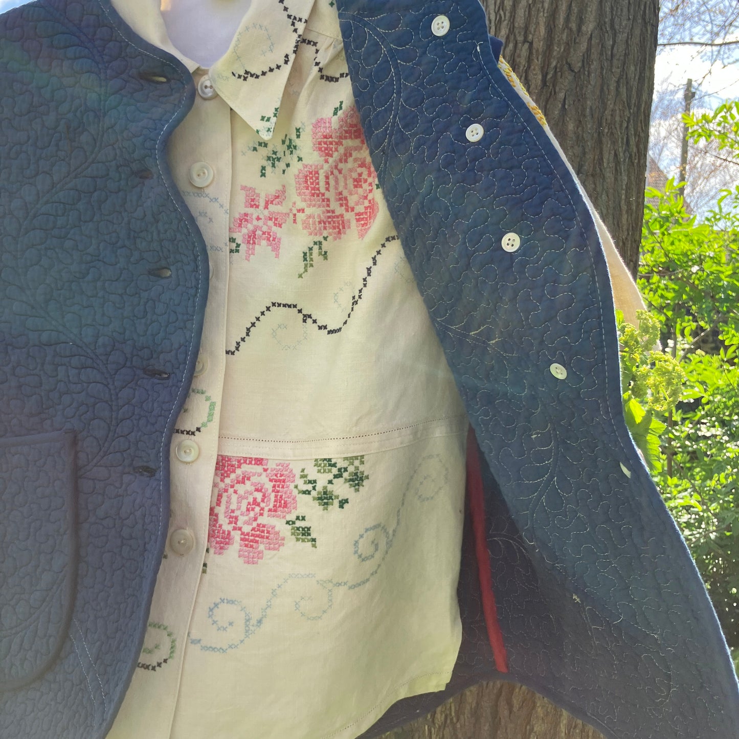 Blouse made from recycled cross stitch linen tablecloth worn with vintage quilt vest