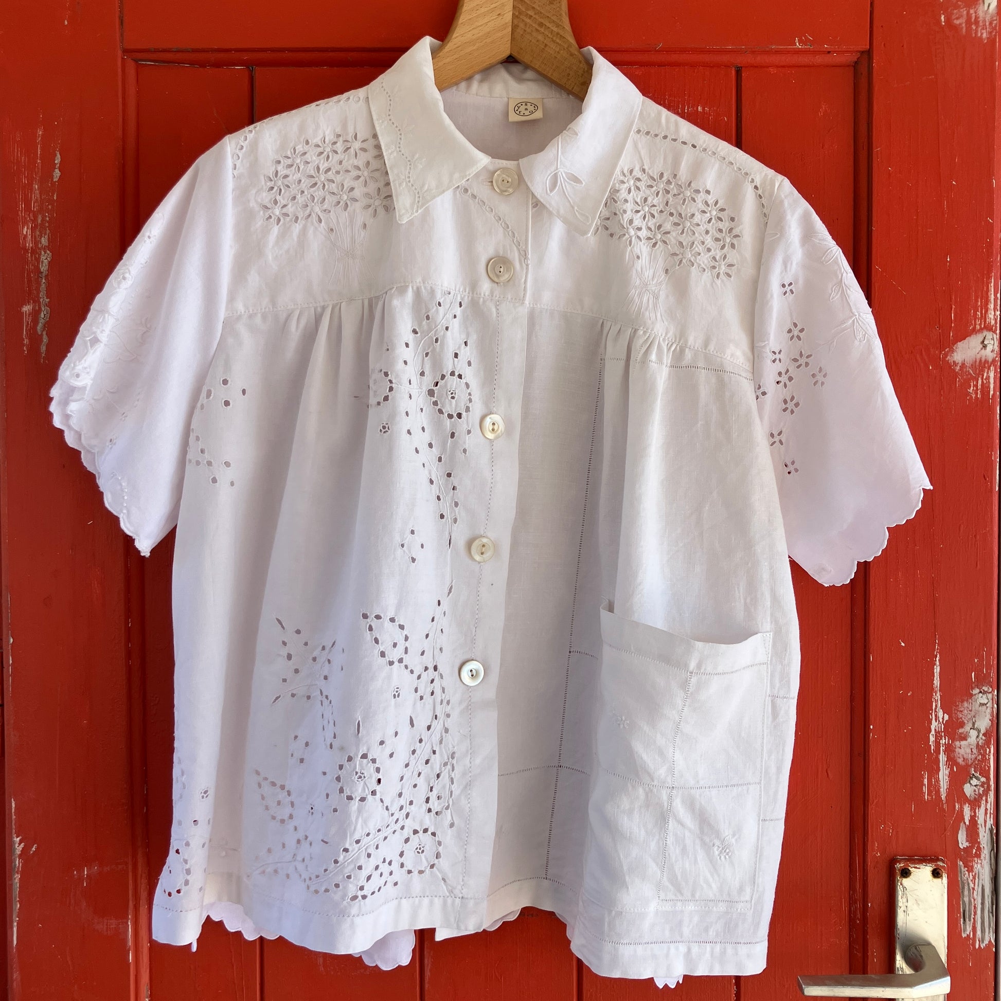pretty, breezy blouse made from a 
patchwork of reclaimed vintage cotton and linen white cutwork tablecloths.