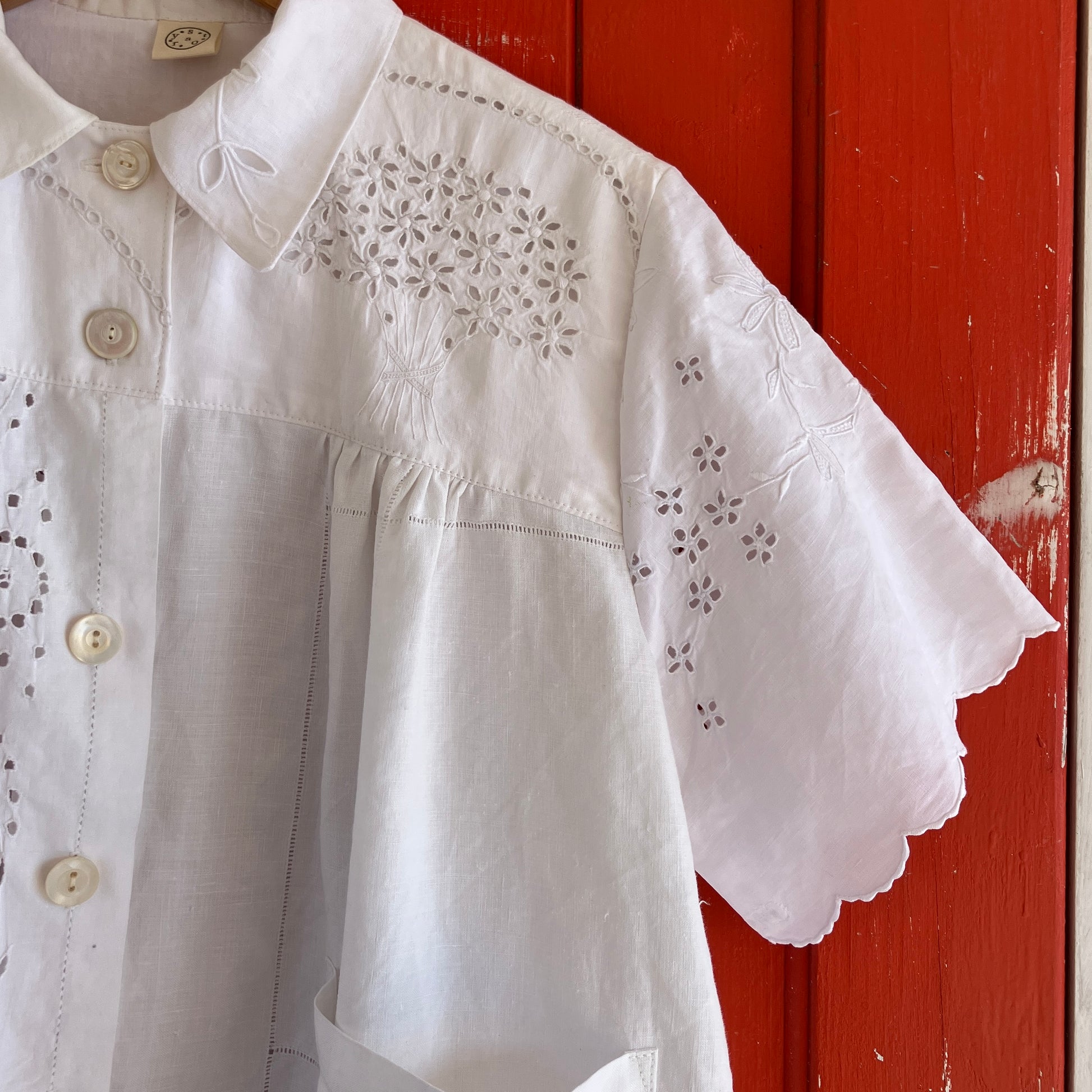 pretty, breezy blouse made from a 
patchwork of reclaimed vintage cotton and linen white cutwork tablecloths.