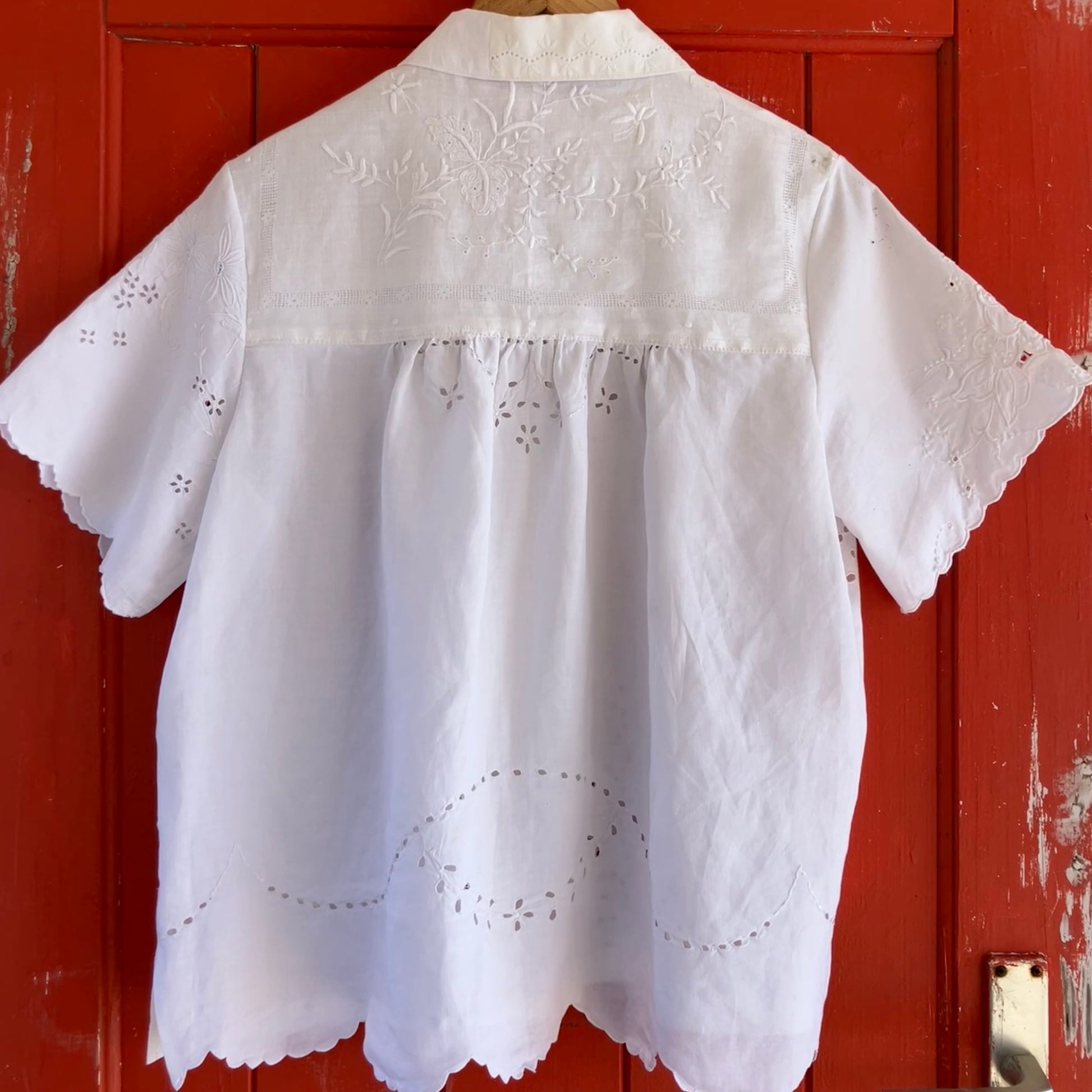 pretty, breezy blouse made from a 
patchwork of reclaimed vintage cotton and linen white cutwork tablecloths.