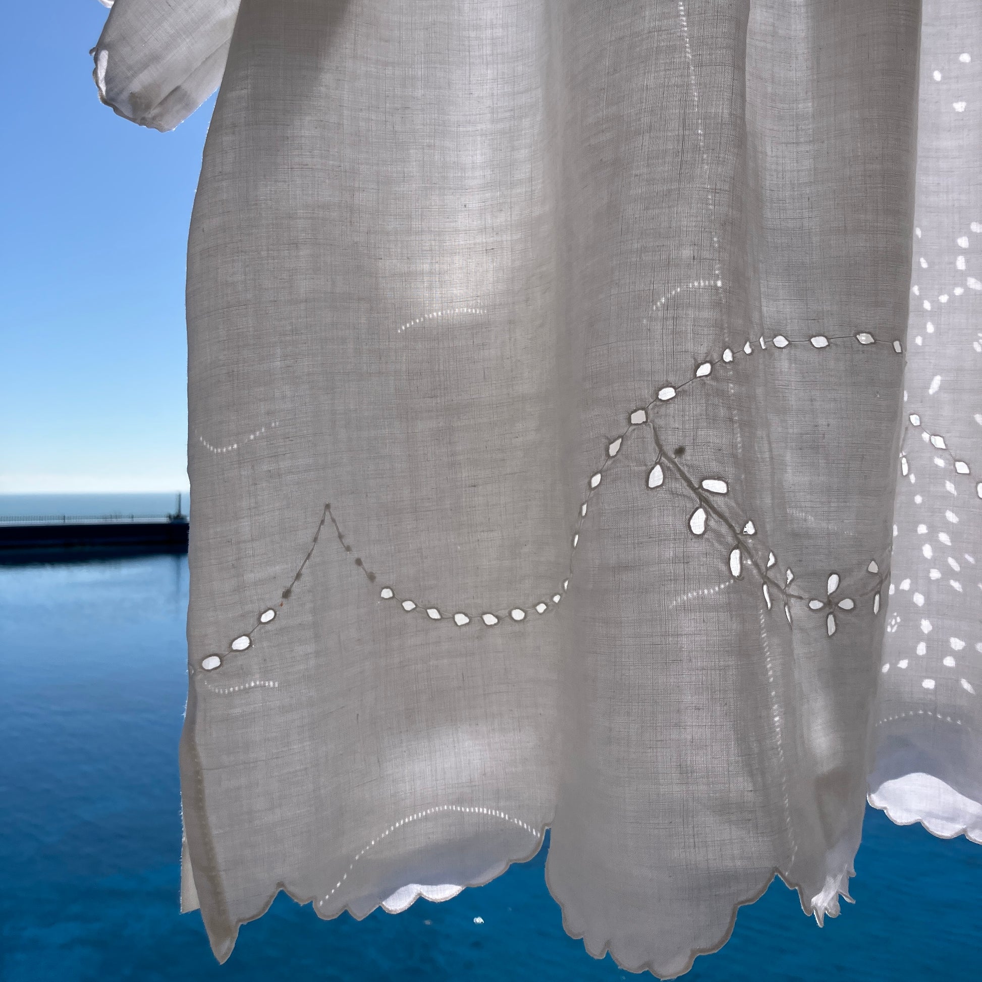 pretty, breezy blouse made from a 
patchwork of reclaimed vintage cotton and linen white cutwork tablecloths.