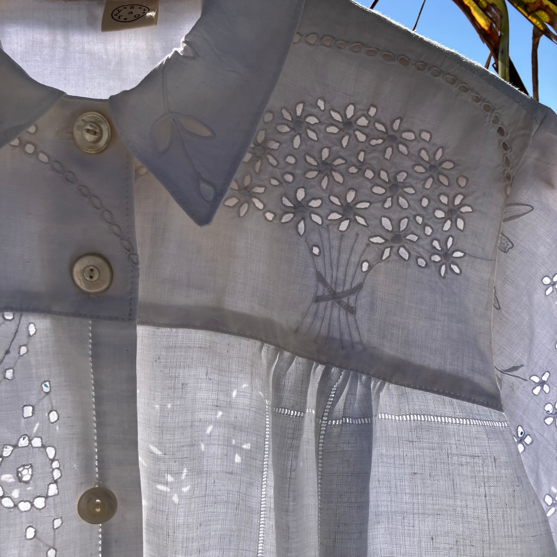 pretty, breezy blouse made from a 
patchwork of reclaimed vintage cotton and linen white cutwork tablecloths.
