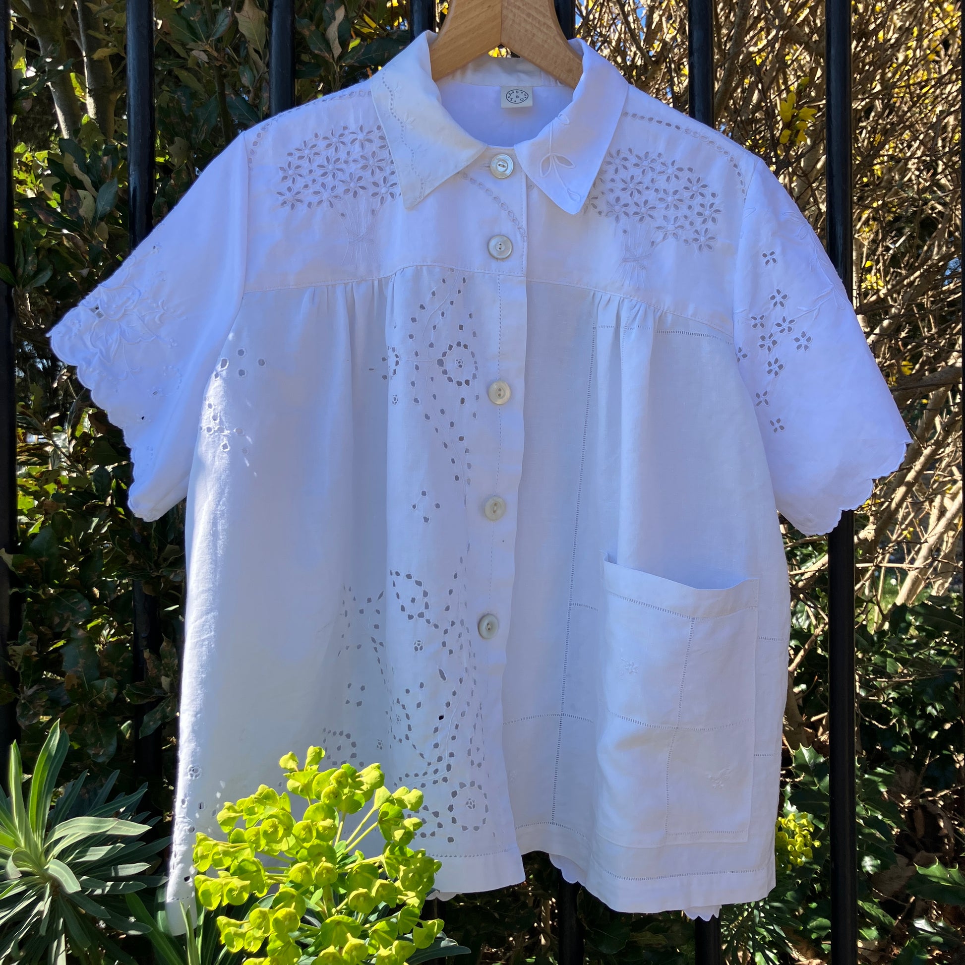 pretty, breezy blouse made from a 
patchwork of reclaimed vintage cotton and linen white cutwork tablecloths.
