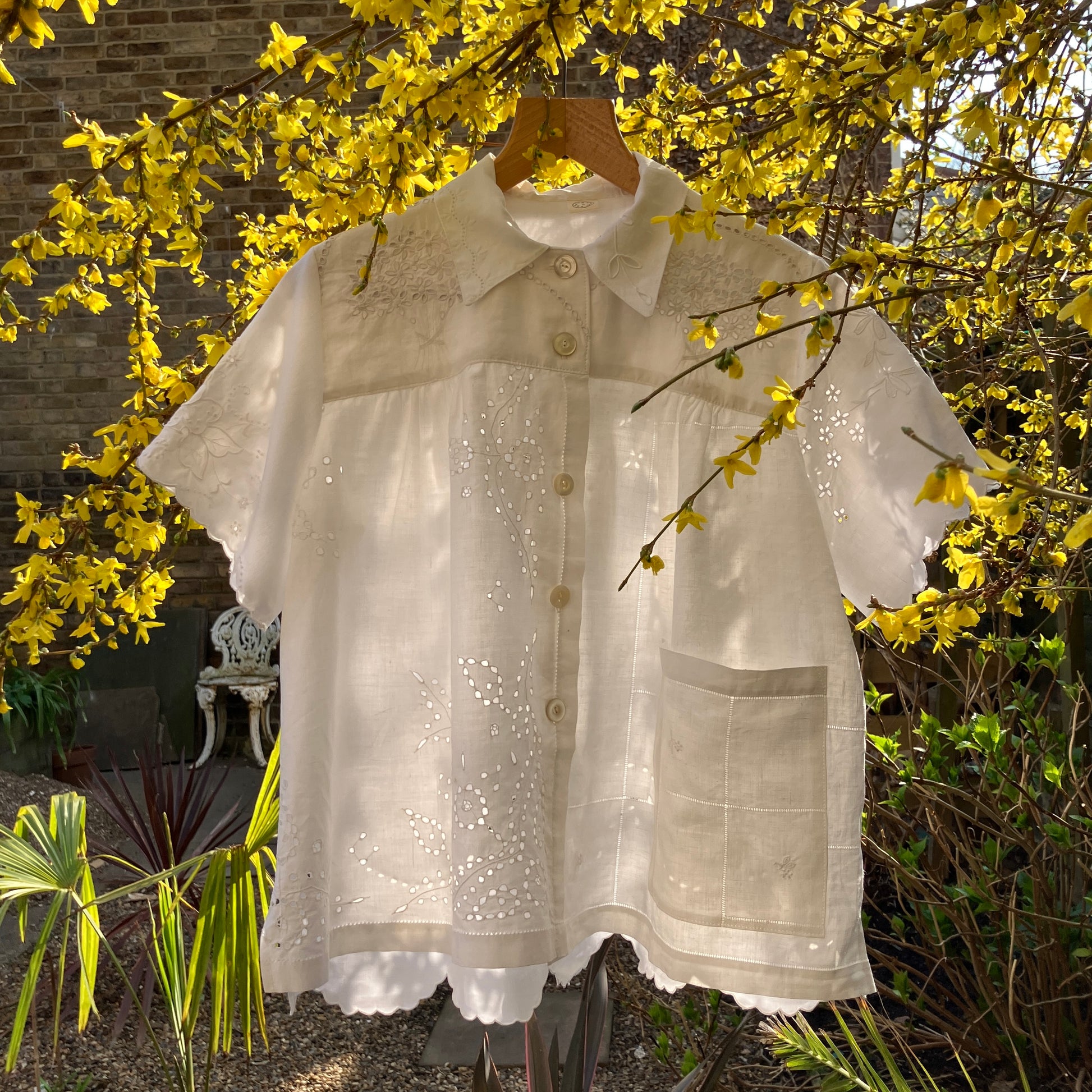 pretty, breezy blouse made from a 
patchwork of reclaimed vintage cotton and linen white cutwork tablecloths.
