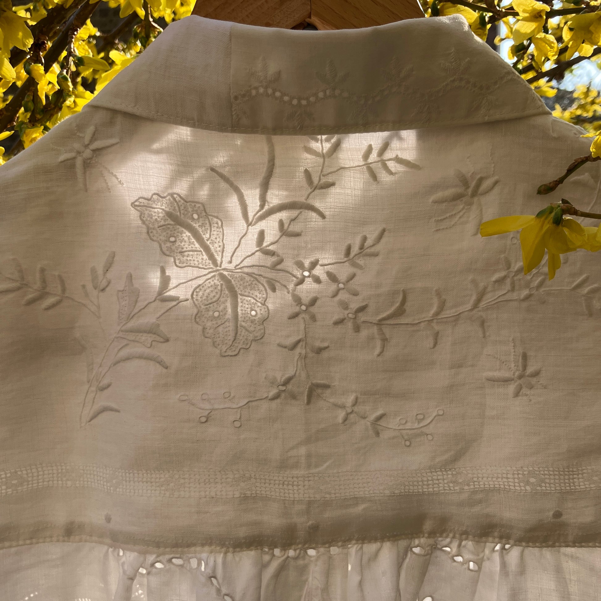 pretty, breezy blouse made from a 
patchwork of reclaimed vintage cotton and linen white cutwork tablecloths.