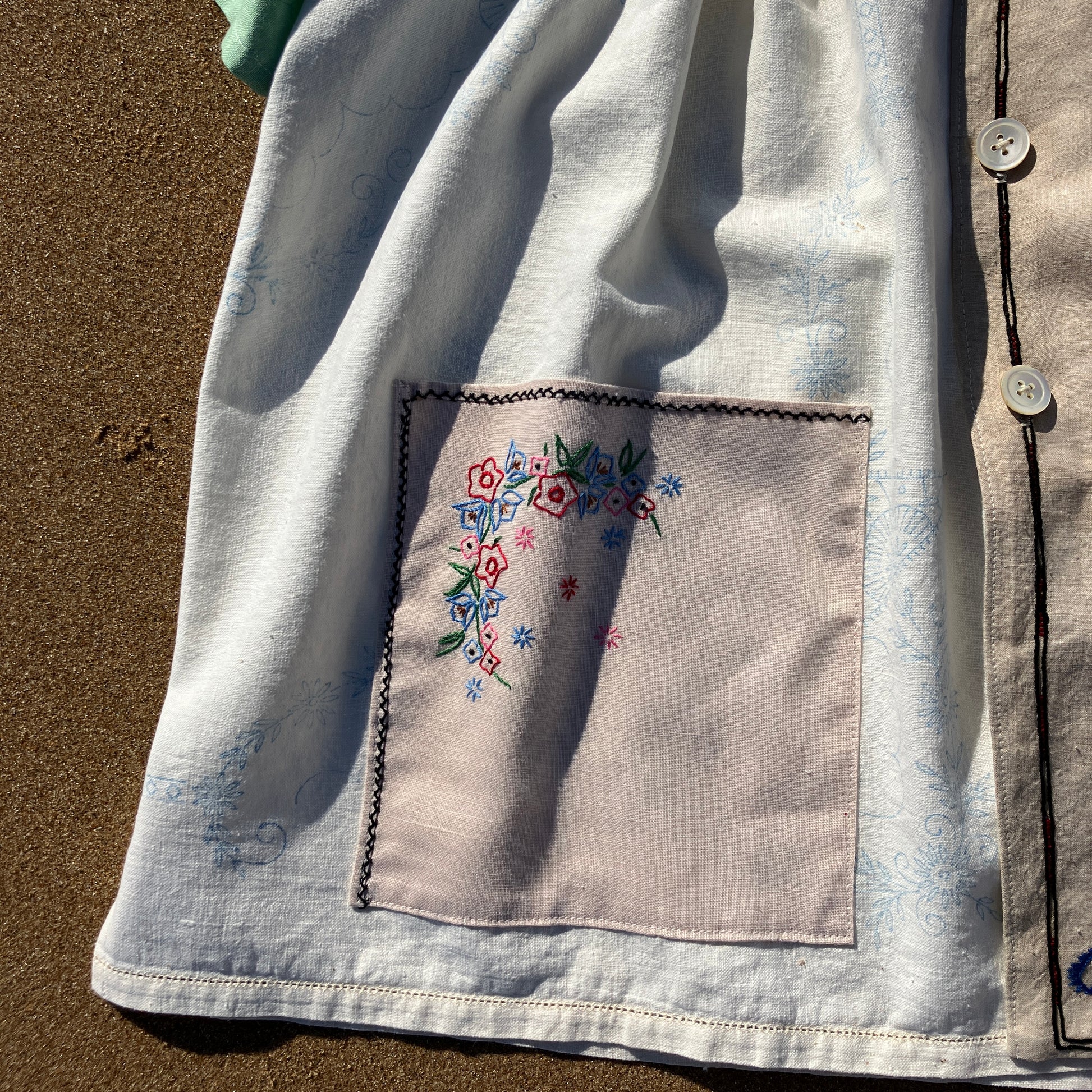 Shirt made from a patchwork of carefully selected reclaimed vintage textiles, including an embroidered map of England and Wales