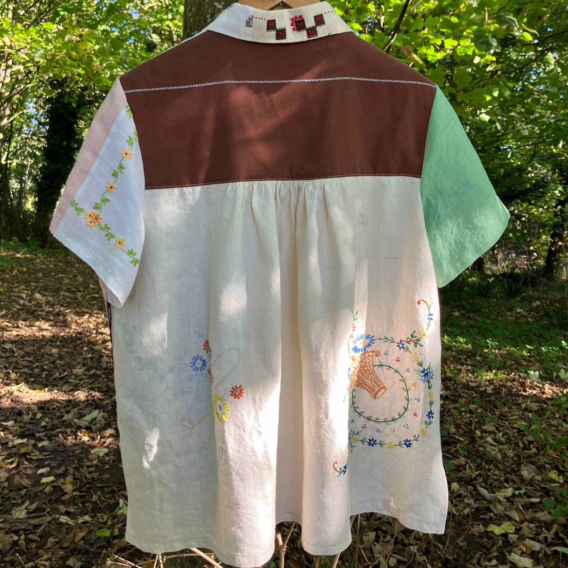 Shirt made from a patchwork of carefully selected reclaimed vintage textiles, including an embroidered map of England and Wales