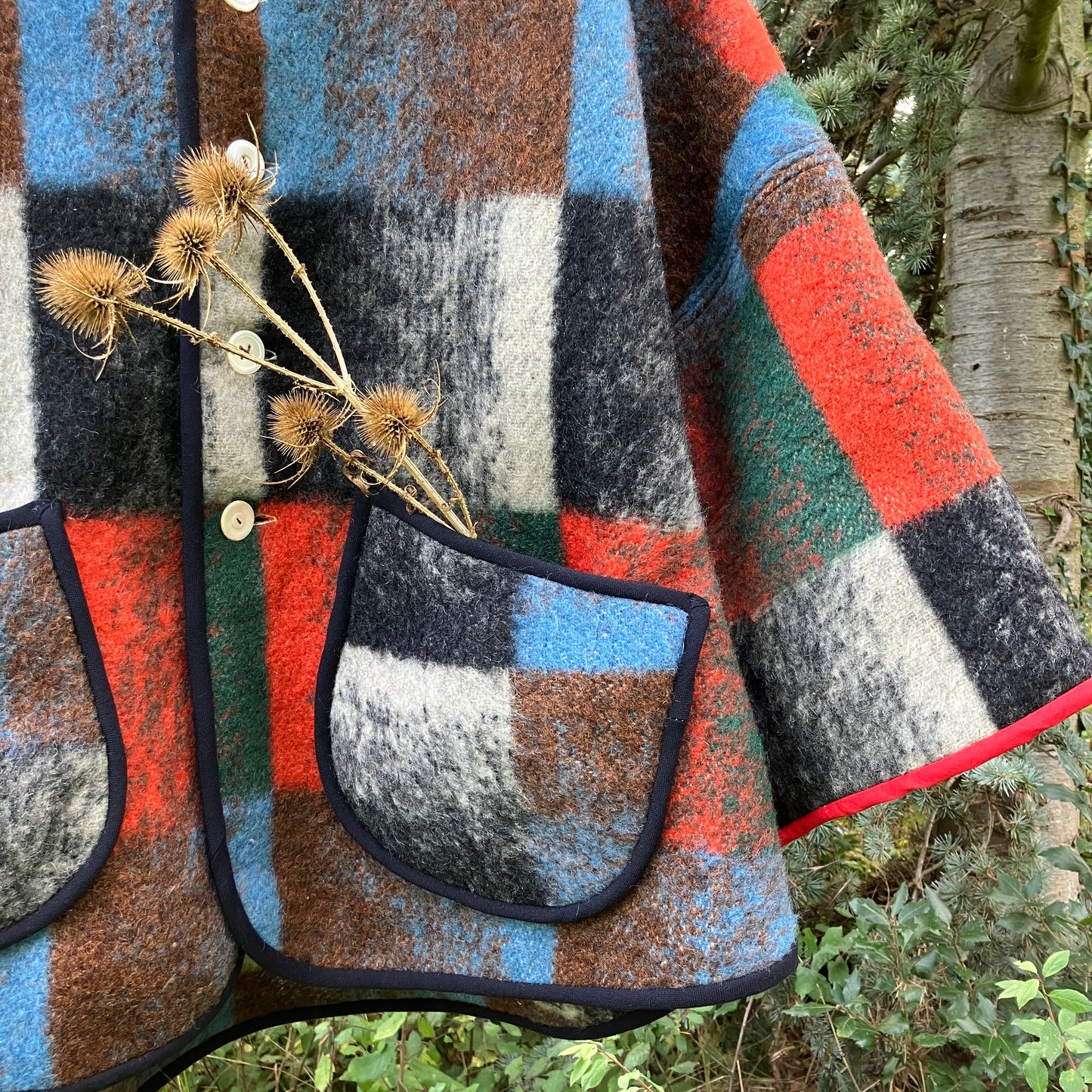 Cosy jacket made from a vintage blanket in autumnal shades of orange, blue, green and brown.