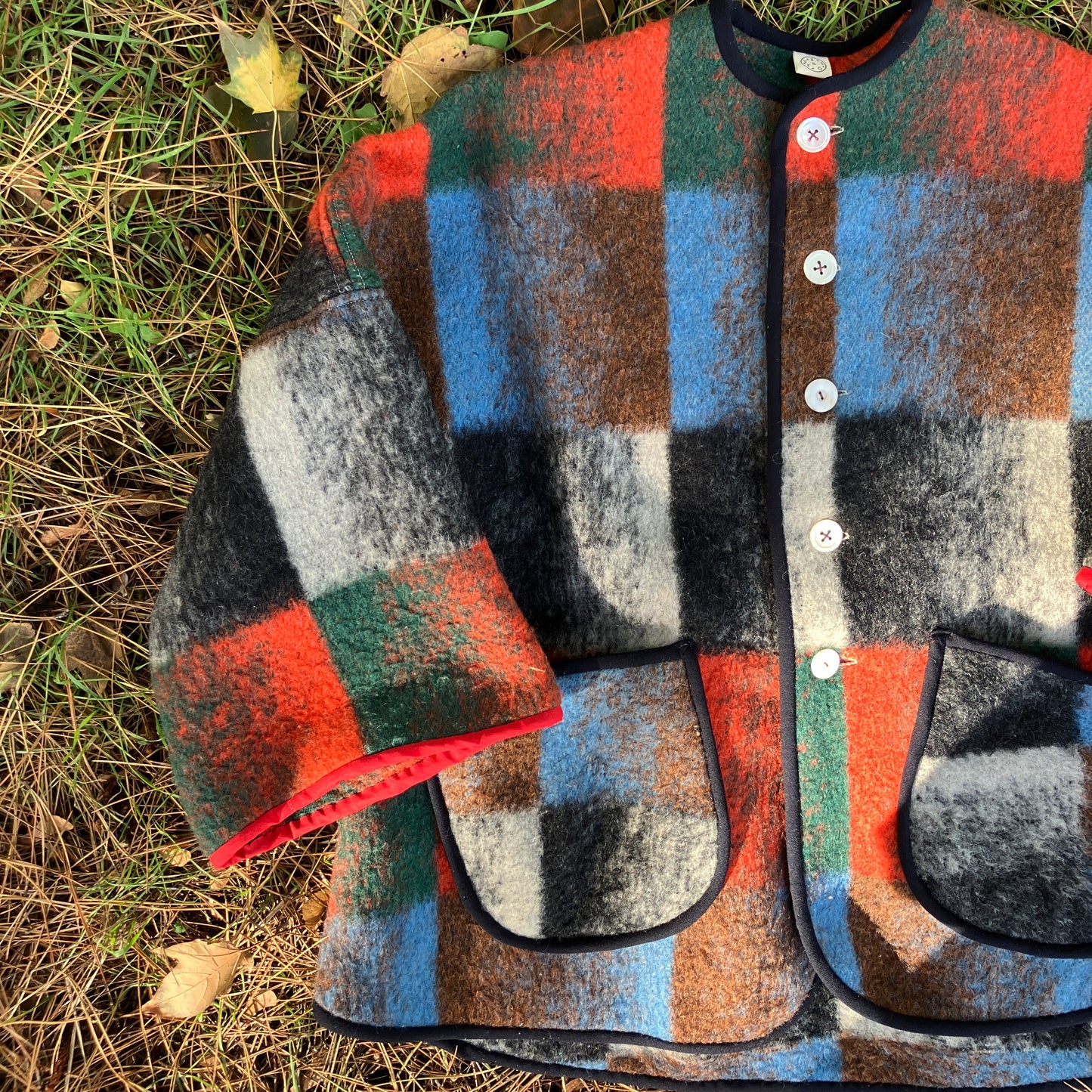 Cosy jacket made from a vintage blanket in autumnal shades of orange, blue, green and brown.