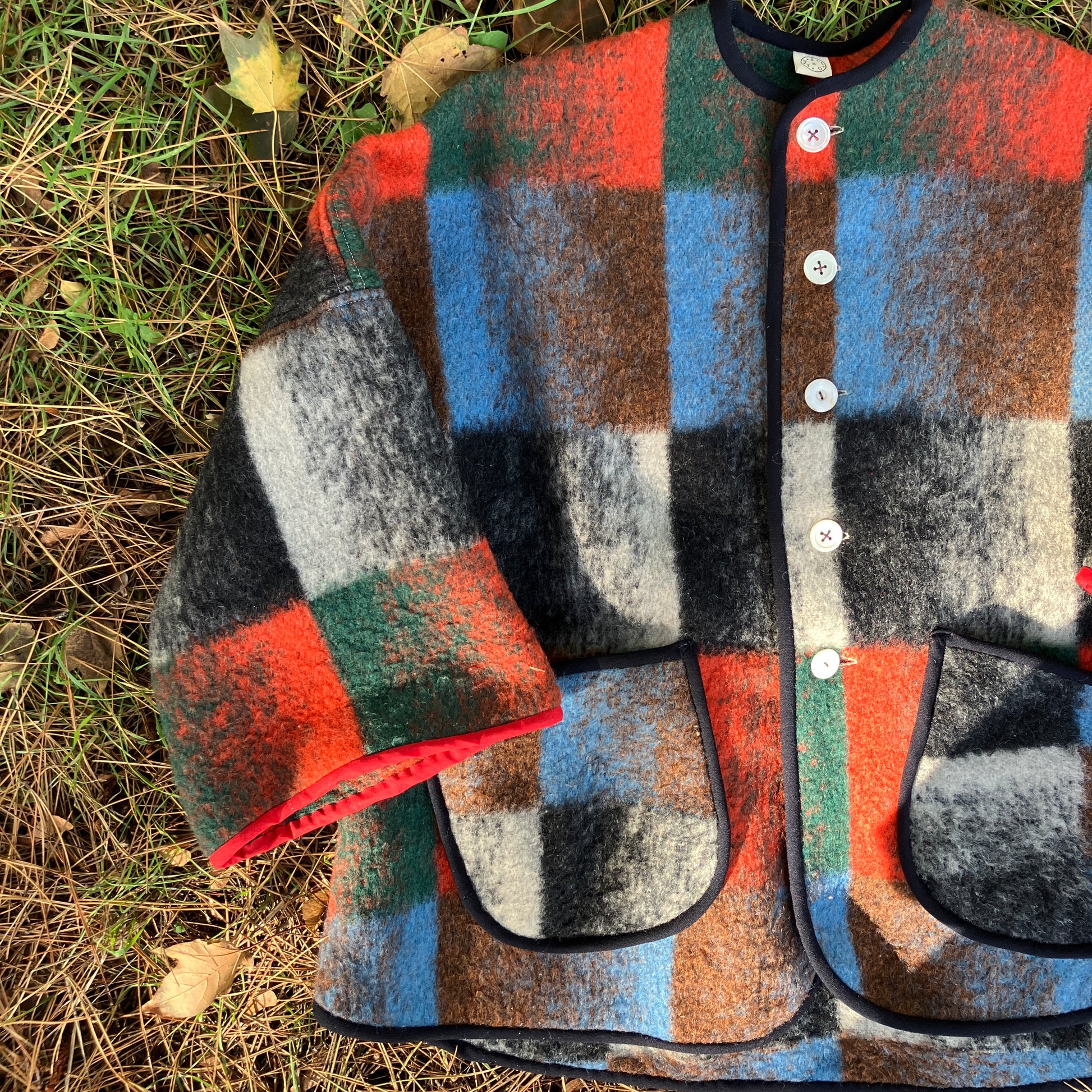 Cosy jacket made from a vintage blanket in autumnal shades of orange, blue, green and brown.