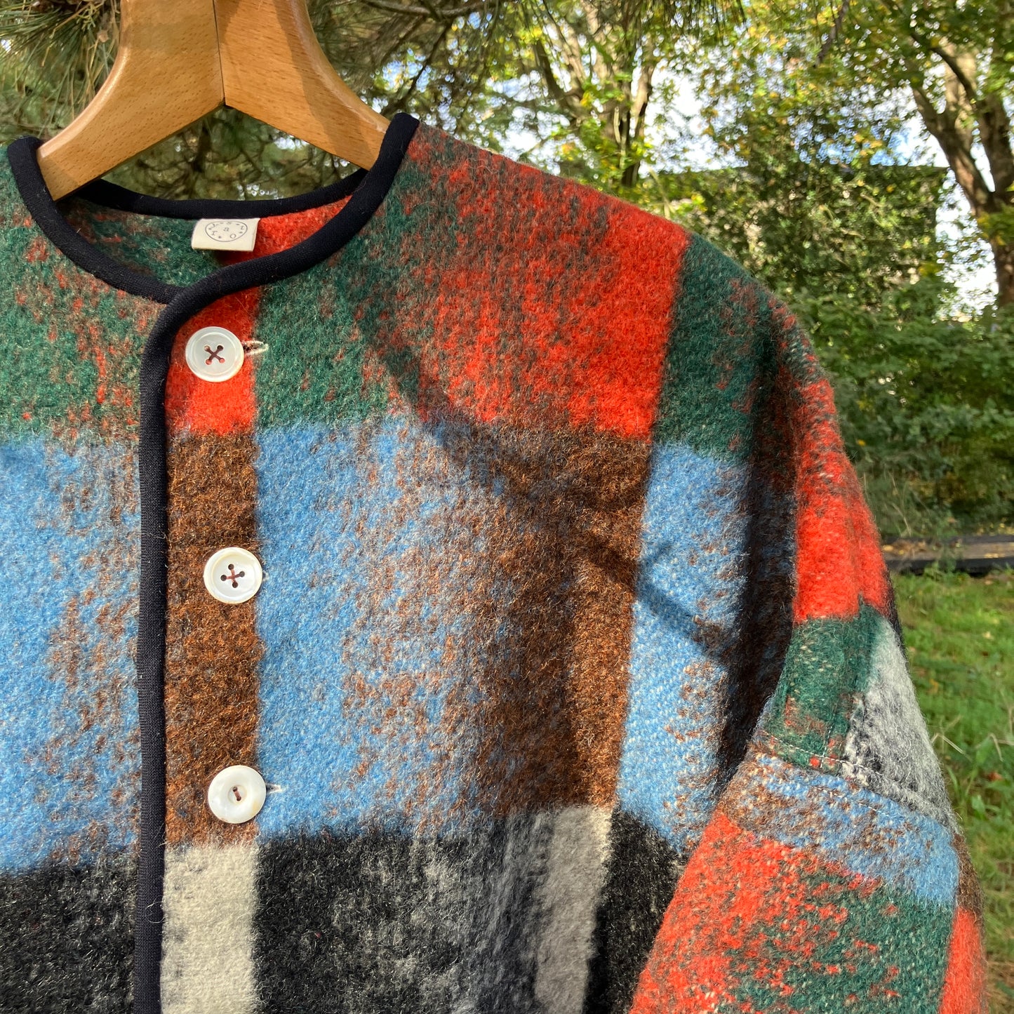 Cosy jacket made from a vintage blanket in autumnal shades of orange, blue, green and brown.