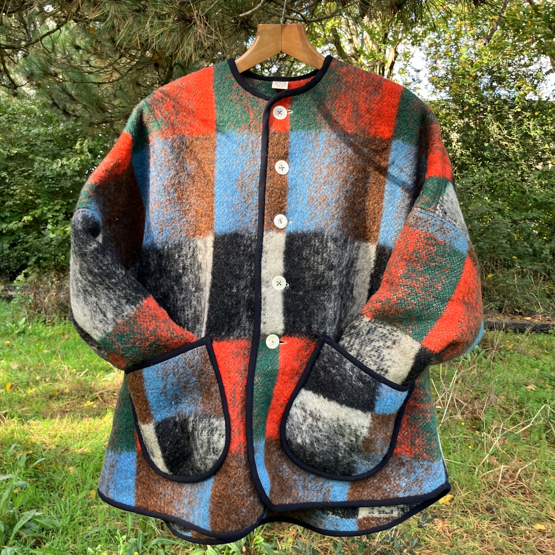 Cosy jacket made from a vintage blanket in autumnal shades of orange, blue, green and brown.
