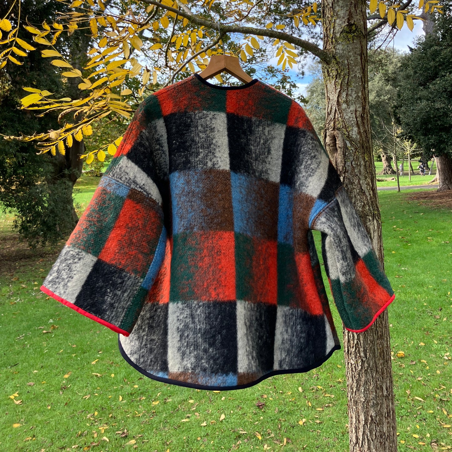 Cosy jacket made from a vintage blanket in autumnal shades of orange, blue, green and brown.