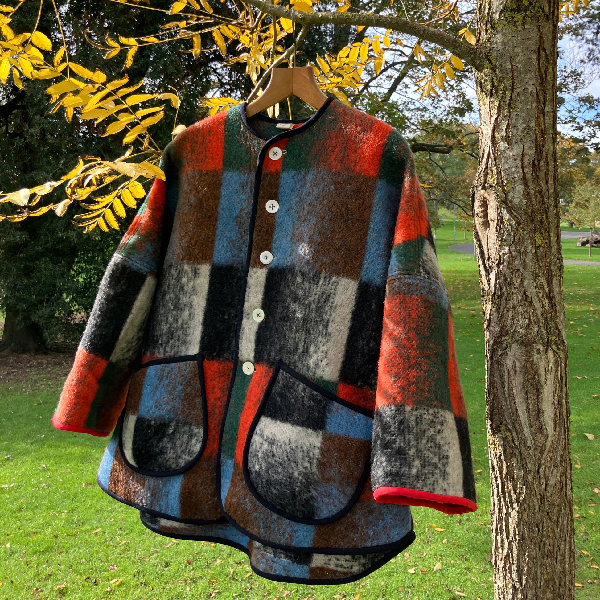Cosy jacket made from a vintage blanket in autumnal shades of orange, blue, green and brown.