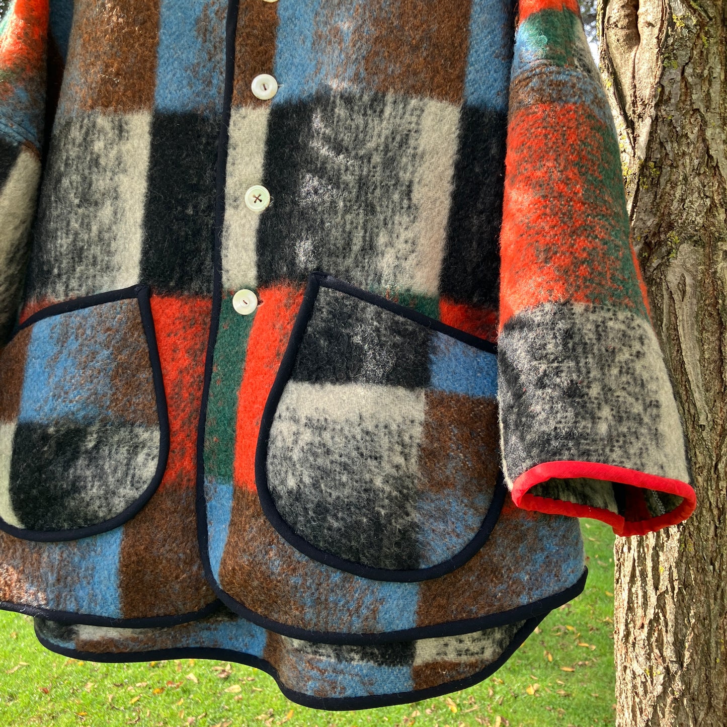 Cosy jacket made from a vintage blanket in autumnal shades of orange, blue, green and brown.