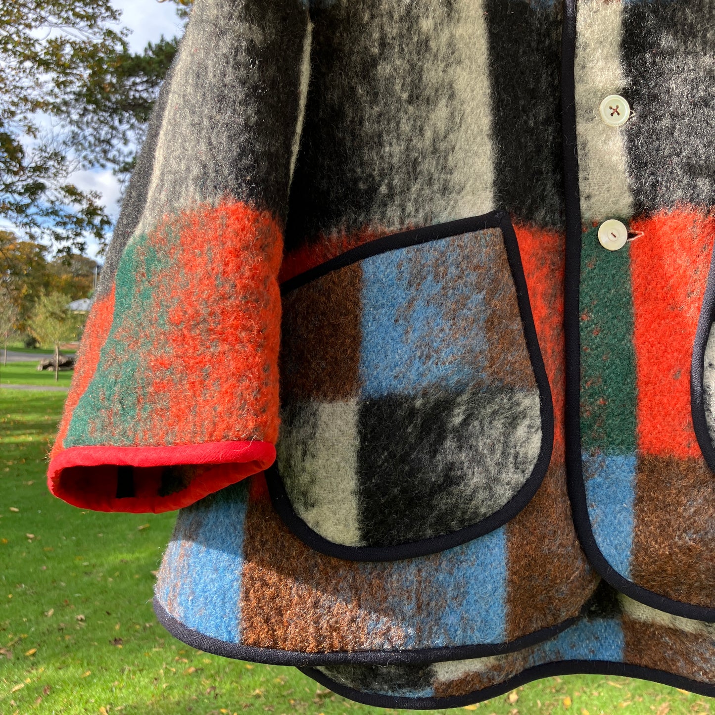 Cosy jacket made from a vintage blanket in autumnal shades of orange, blue, green and brown.