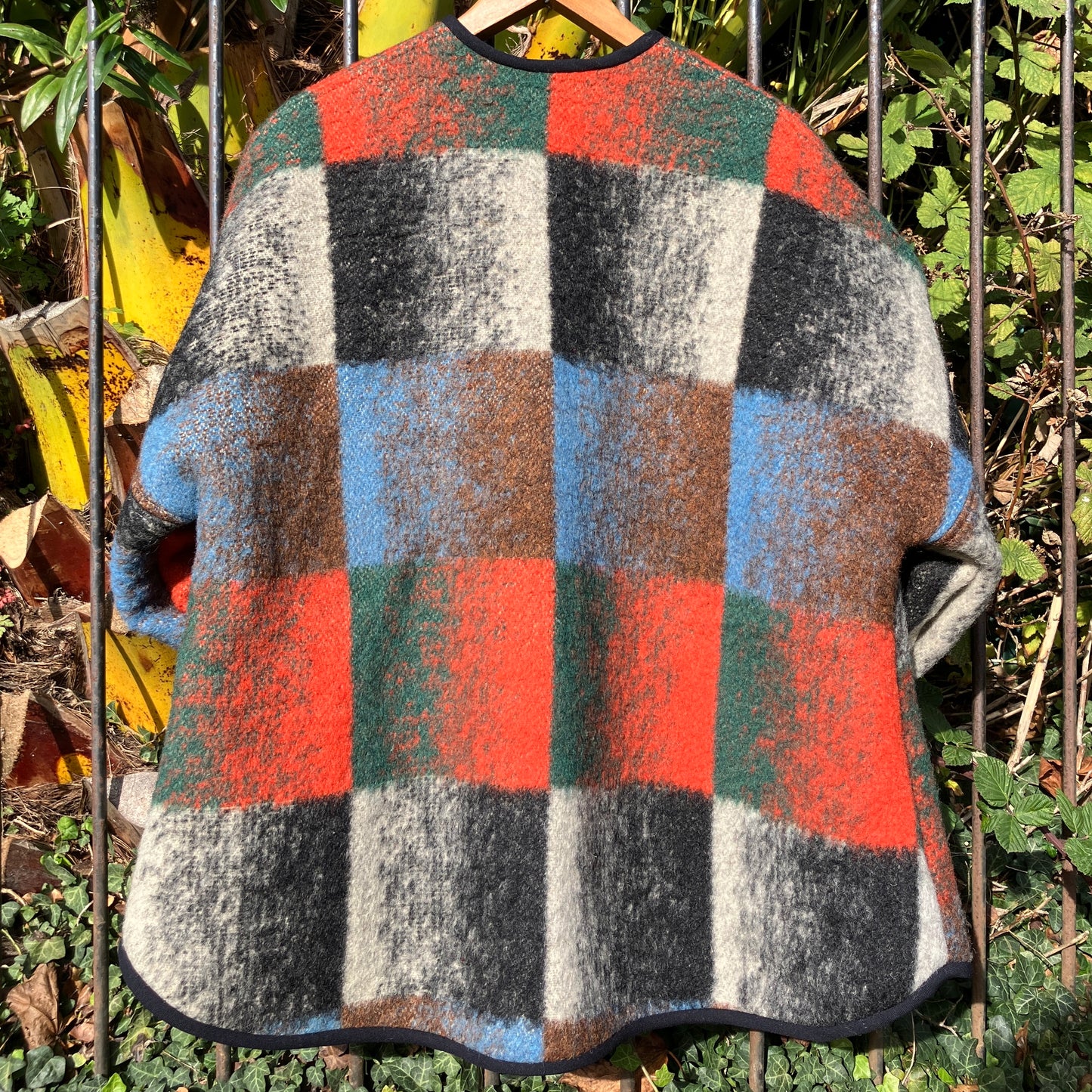 Cosy jacket made from a vintage blanket in autumnal shades of orange, blue, green and brown.