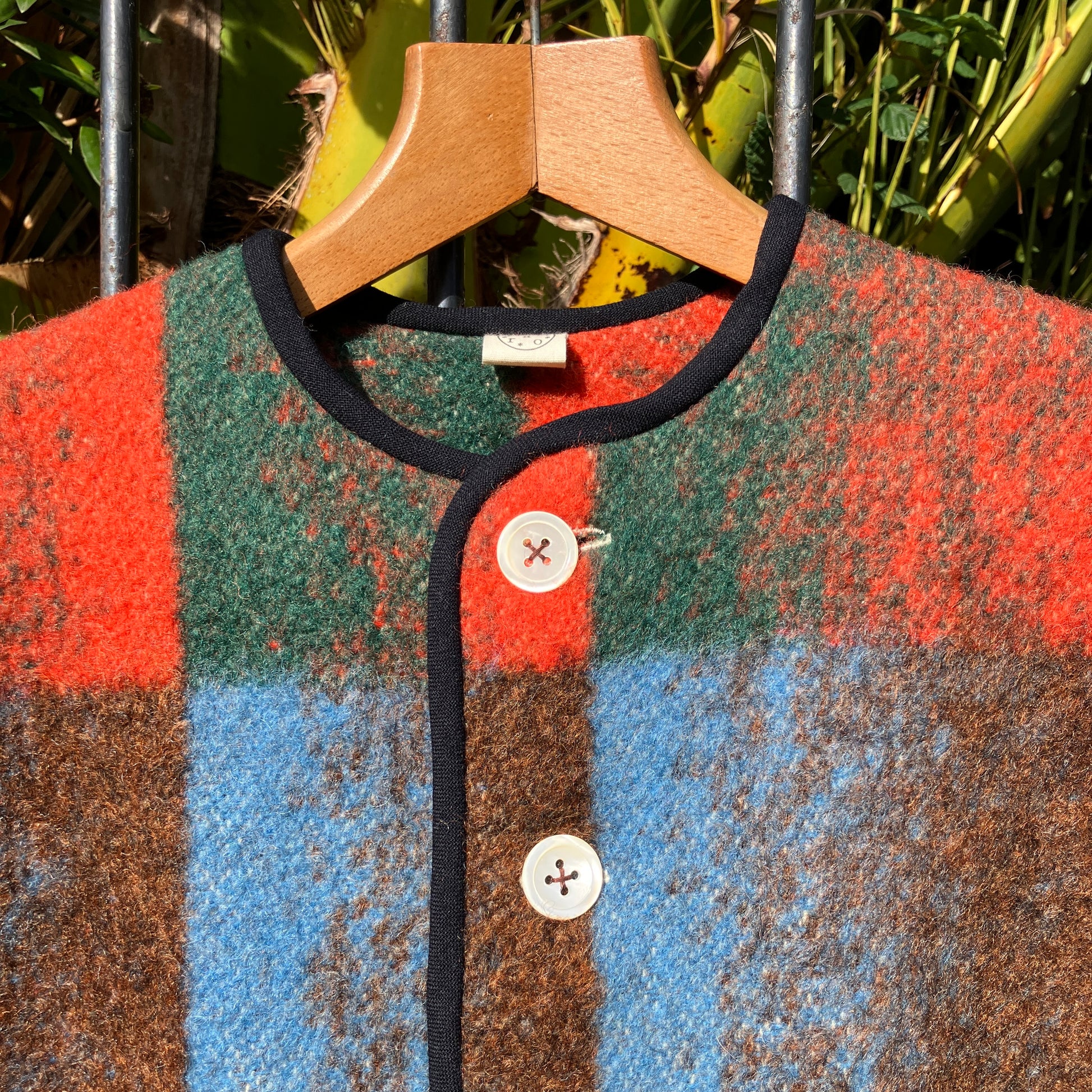 Cosy jacket made from a vintage blanket in autumnal shades of orange, blue, green and brown.