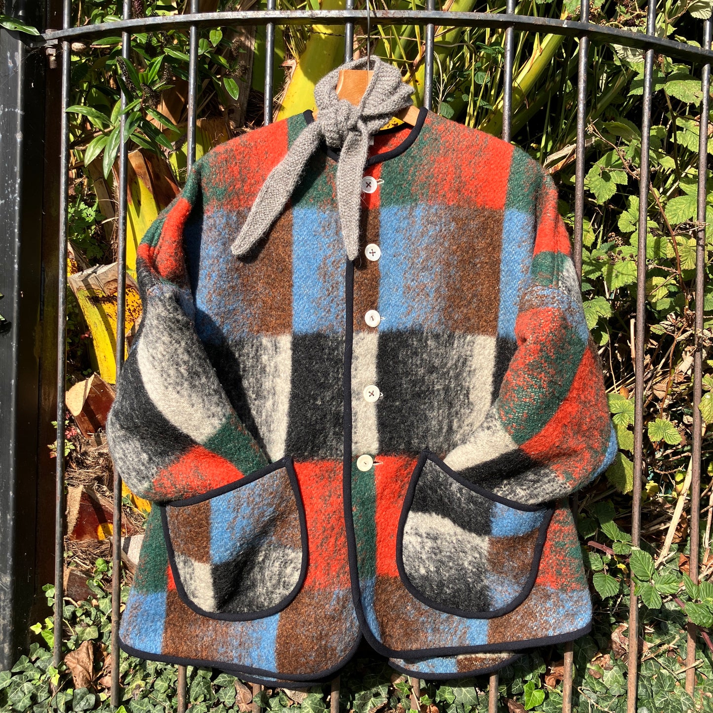 Cosy jacket made from a vintage blanket in autumnal shades of orange, blue, green and brown.