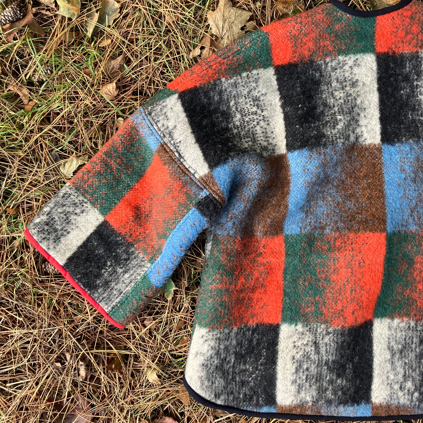 Cosy jacket made from a vintage blanket in autumnal shades of orange, blue, green and brown.
