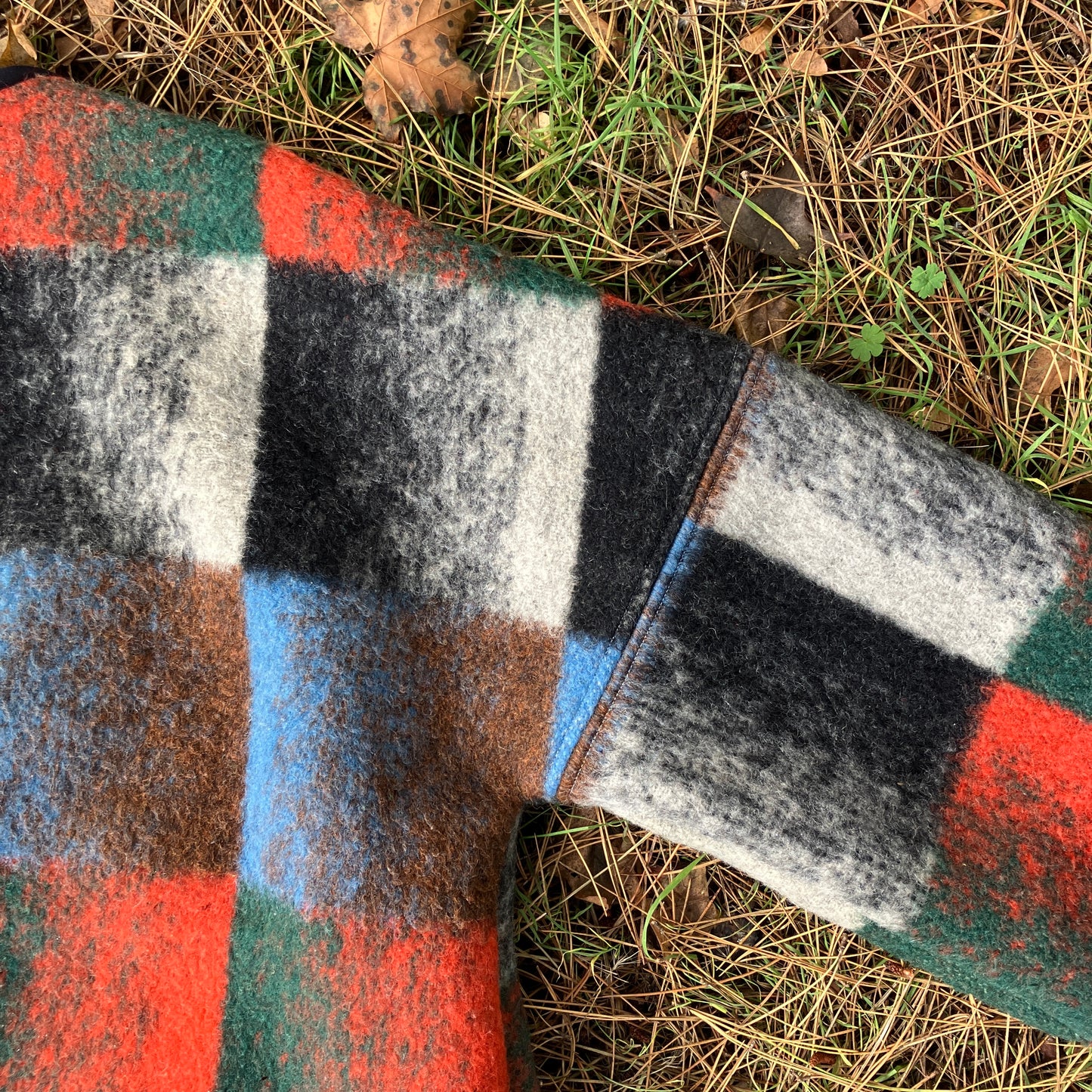 Cosy jacket made from a vintage blanket in autumnal shades of orange, blue, green and brown.