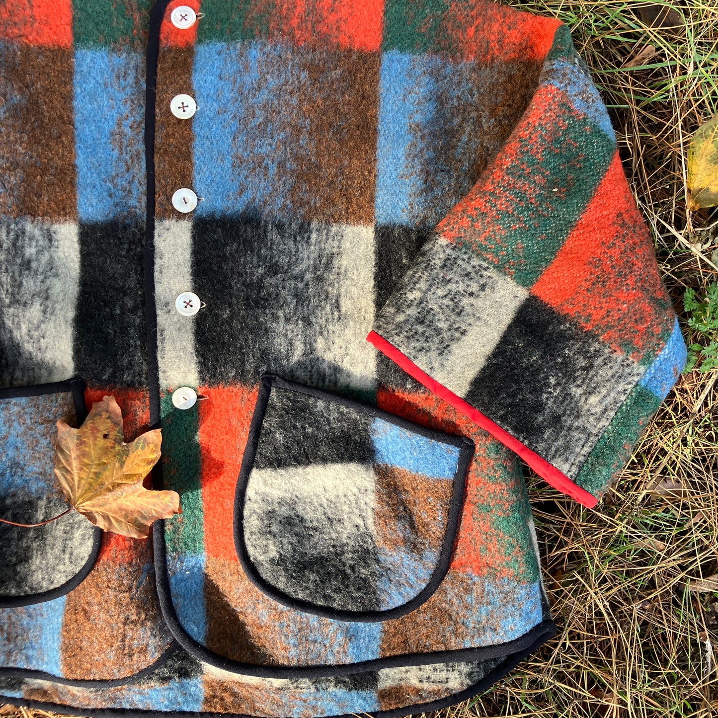 Cosy jacket made from a vintage blanket in autumnal shades of orange, blue, green and brown.