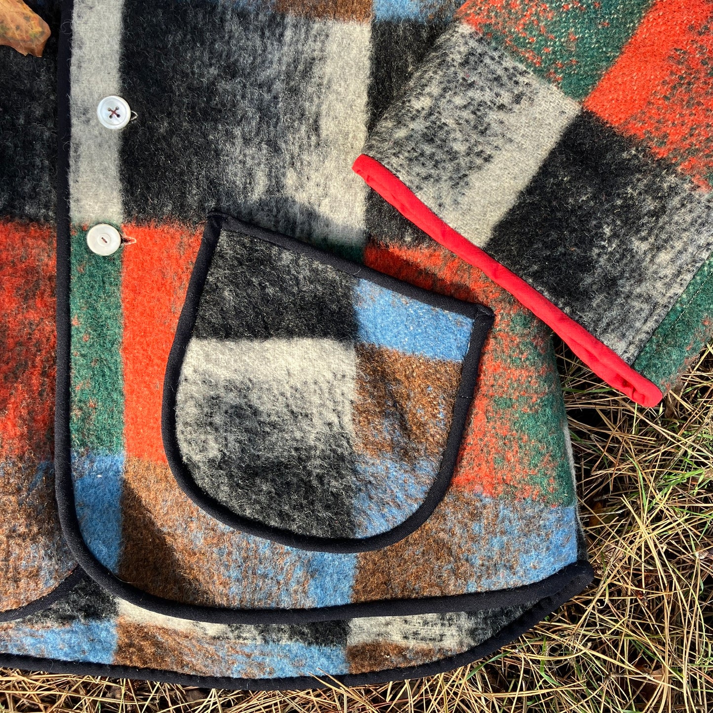 Cosy jacket made from a vintage blanket in autumnal shades of orange, blue, green and brown.