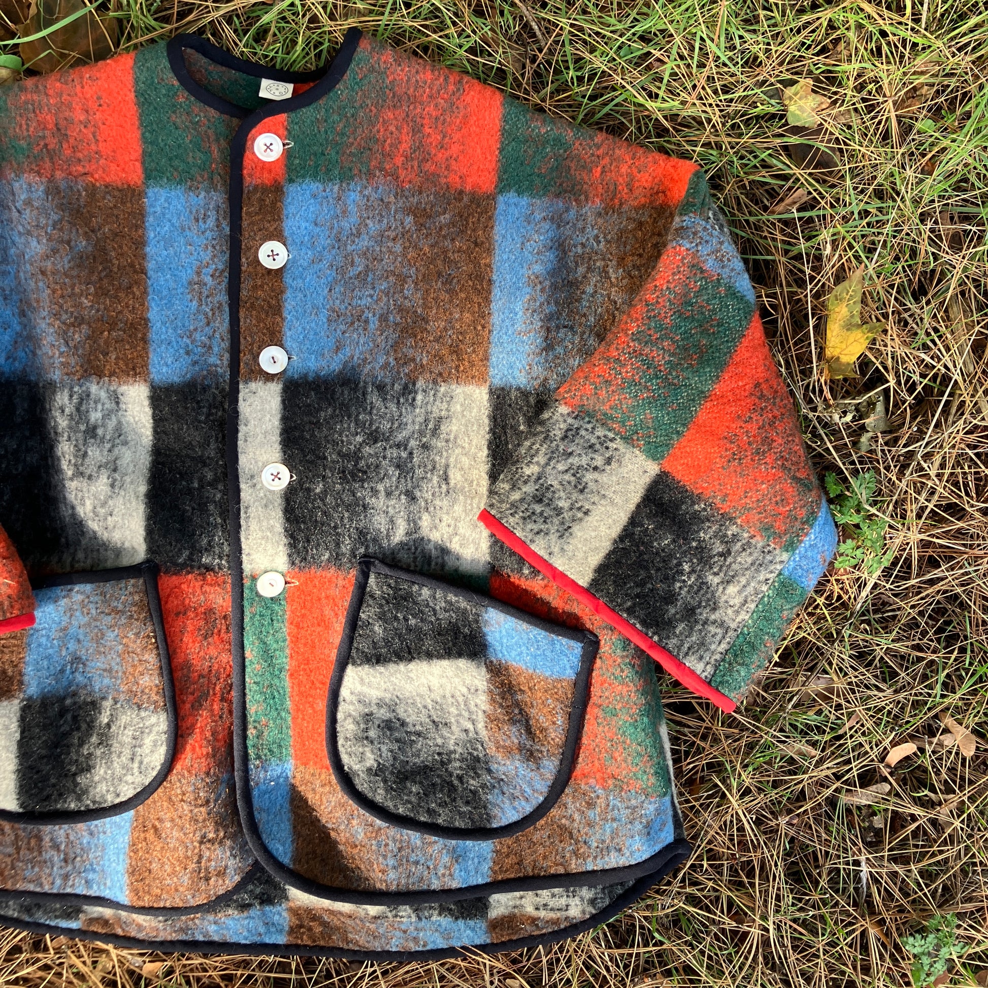 Cosy jacket made from a vintage blanket in autumnal shades of orange, blue, green and brown.