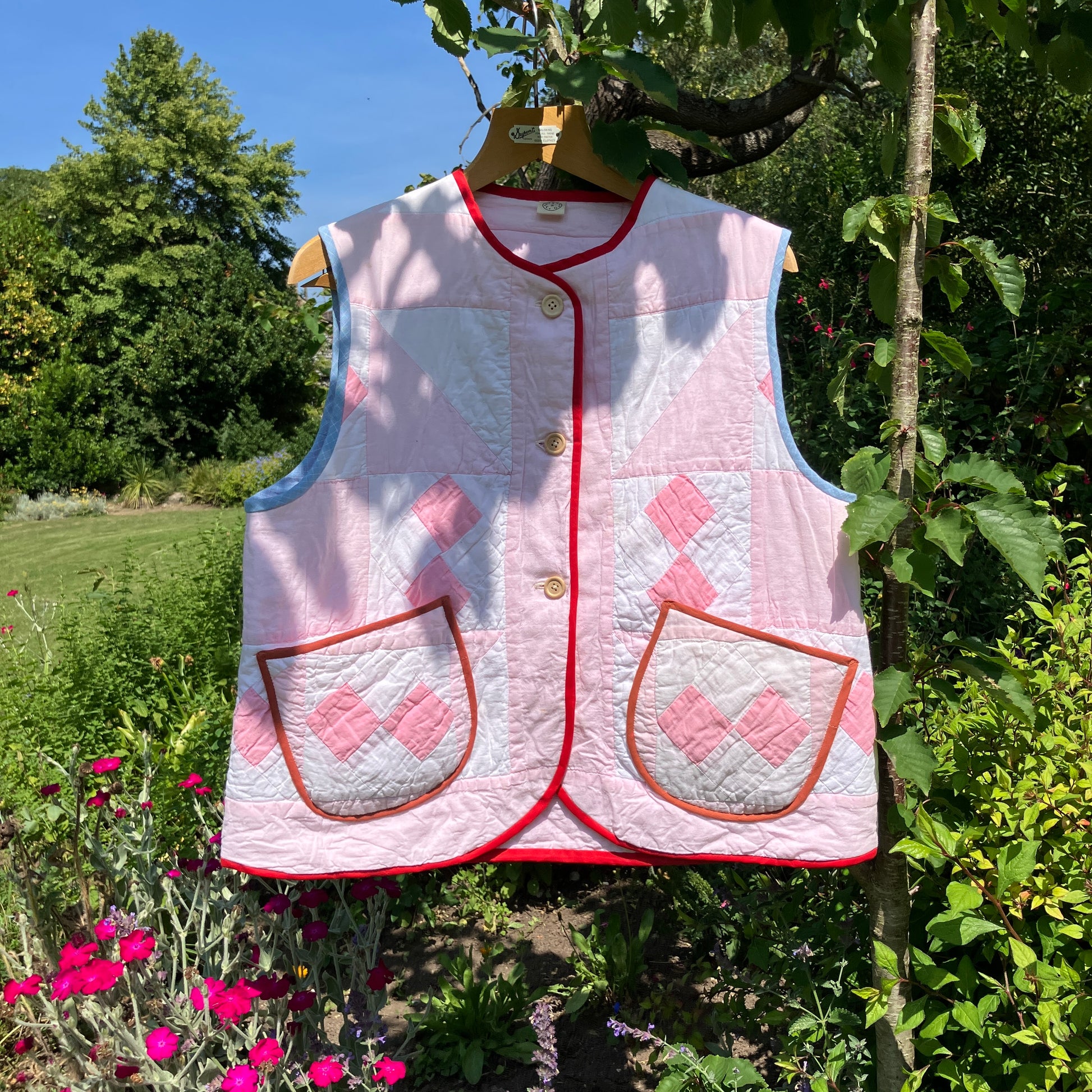 Vest made from a reclaimed pink and white patchwork quilt