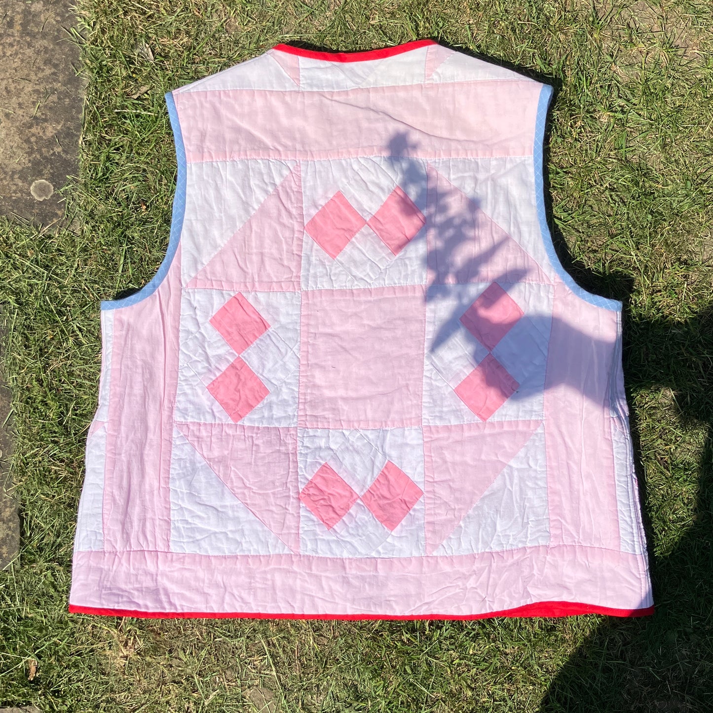 Vest made from a reclaimed pink and white patchwork quilt